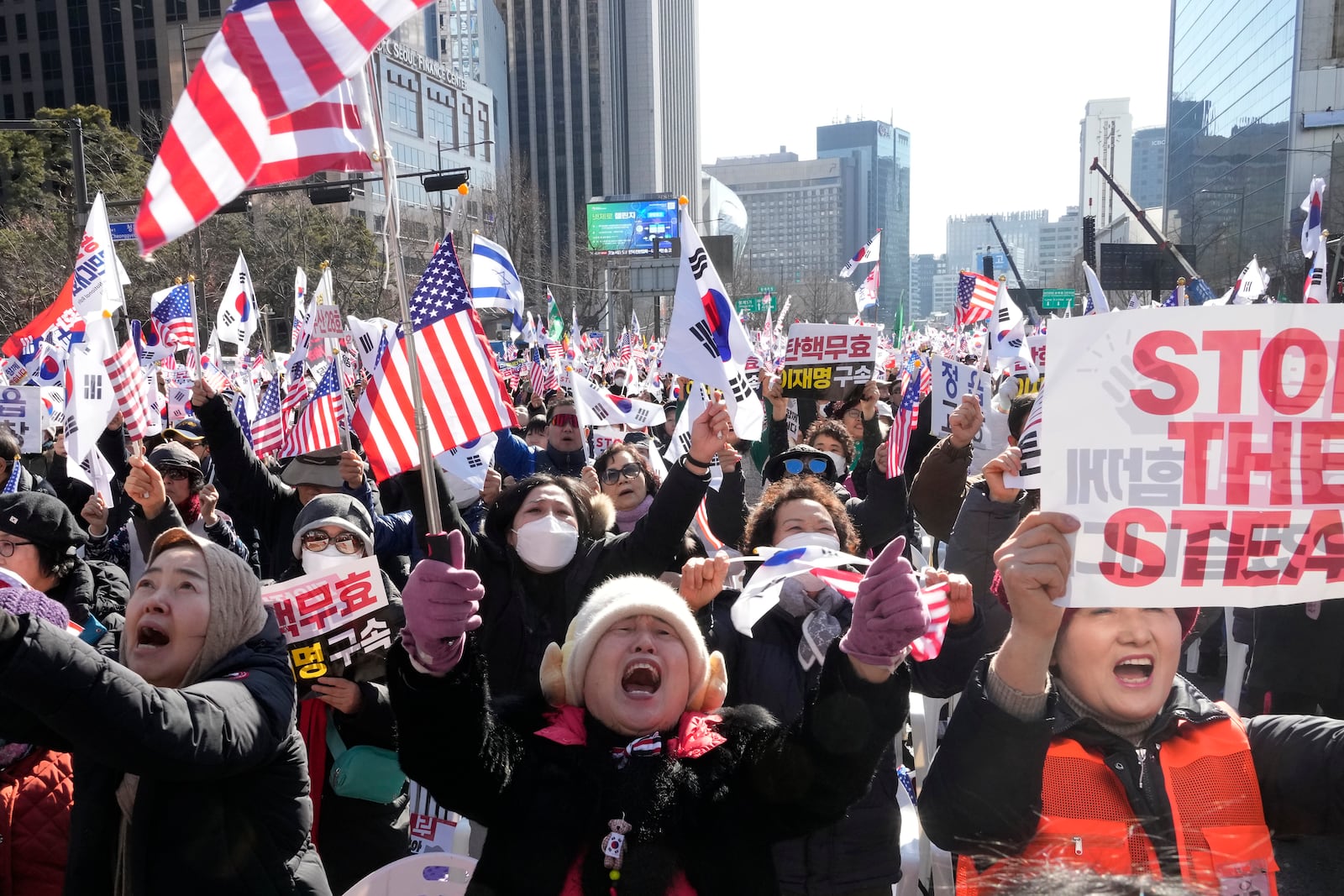 Supporters of impeached South Korean President Yoon Suk Yeol attend a rally to oppose his impeachment in Seoul, South Korea, Saturday, Jan. 25, 2025. (AP Photo/Ahn Young-joon)