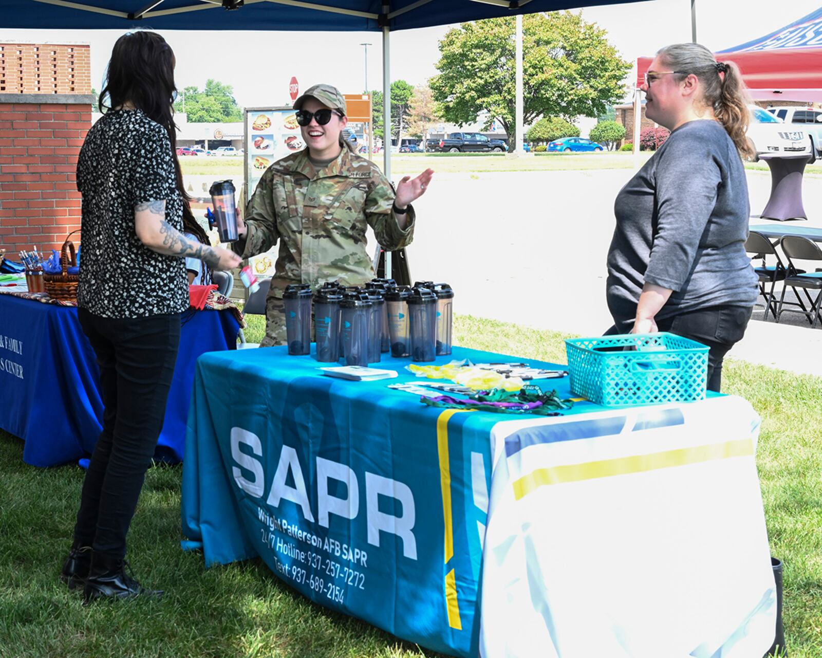 Festivalgoers learn about the Sexual Assault Prevention and Response program and resources during the Women’s Equality Day festival Aug. 26. U.S. AIR FORCE PHOTO/JAIMA FOGG