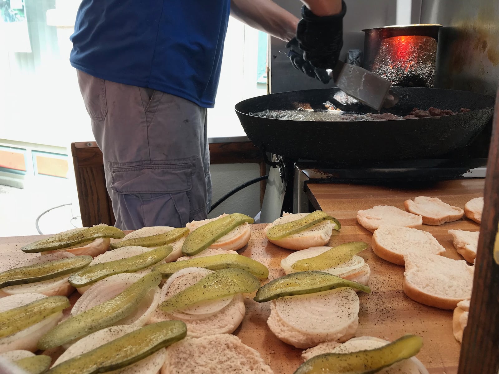 The Hamburger Wagon in Miamisburg, Ohio is famous for deep frying its patties in a cast iron skillet.