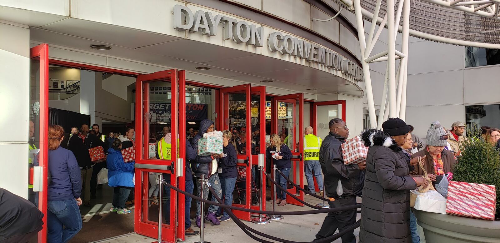 Target Dayton Ministries held its Christmas service at the Dayton Convention Center Wednesday, Dec. 25, 2019, and volunteers greeted attendees as they entered the venue, then worked to distribute 2,200 box lunches and gift boxes as they exited. ERIC SCHWARTZBERG/STAFF