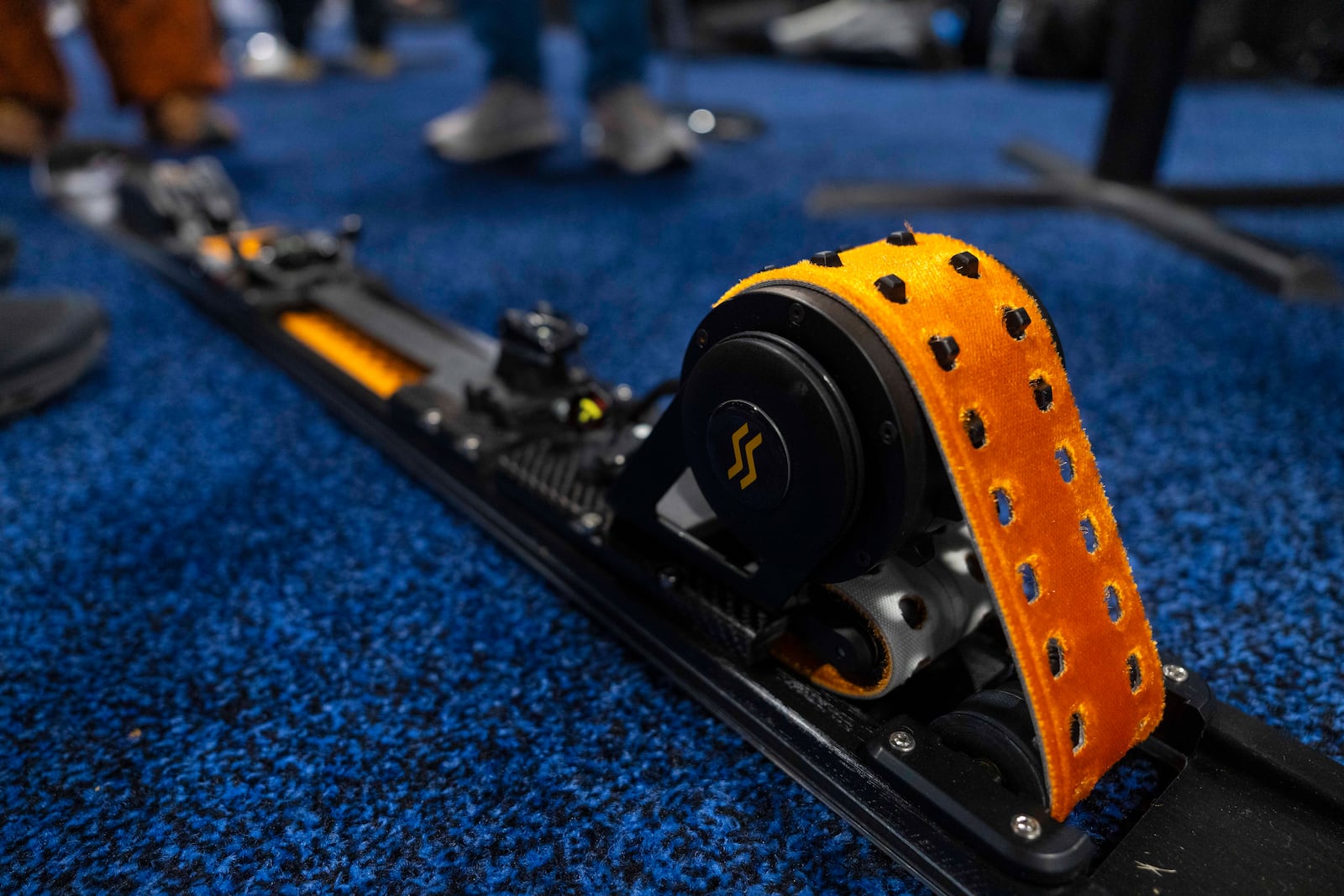 E-SKIMO showcases the first electrical assisted e-ski mountaineering device, which has a removable belt to help propel your ascent and with it removed, you can descend like on a regular ski, during 2025 CES Unveiled, Sunday, Jan. 5, 2025, in Las Vegas. (AP Photo/Jack Dempsey)