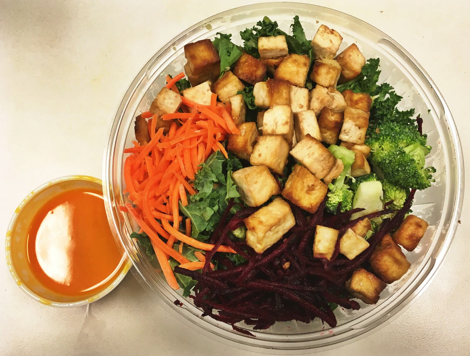 The Sriracha Ginger Tofu & Ancient Grains was the only vegan option we tried. It featured warm quinoa, shredded kale, roasted tofu, carrots, raw beets, broccoli, ginger, sriracha. We tried it with the suggested carrot chili vinaigrette dressing. SIERRA SMITH / STAFF