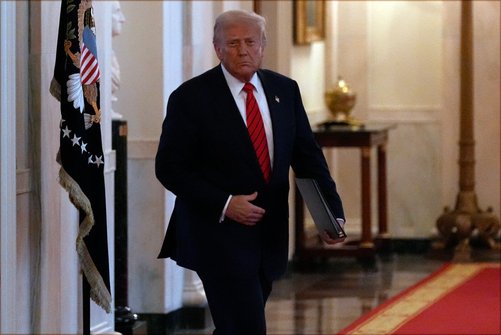 President Donald Trump arrives before signing an executive order barring transgender female athletes from competing in women's or girls' sporting events, in the East Room of the White House, Wednesday, Feb. 5, 2025, in Washington. (AP Photo/Alex Brandon)