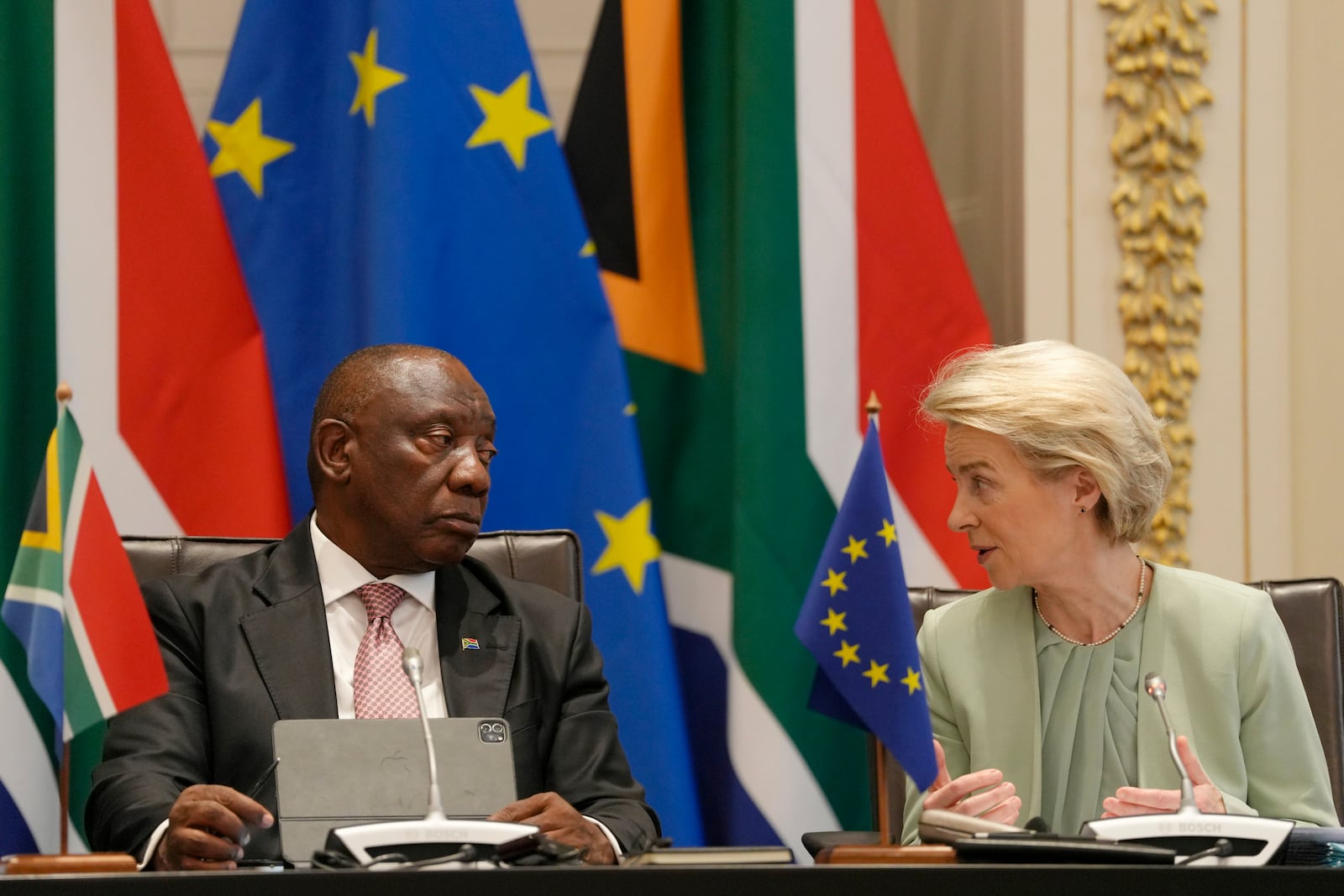 South Africa's President Cyril Ramaphosa, left, and European Commission President Ursula von der Leyen speak during the opening remarks at the eighth EU-South Africa summit in Cape Town, South Africa, Thursday, March 13, 2025. (AP Photo/Nardus Engelbrecht)