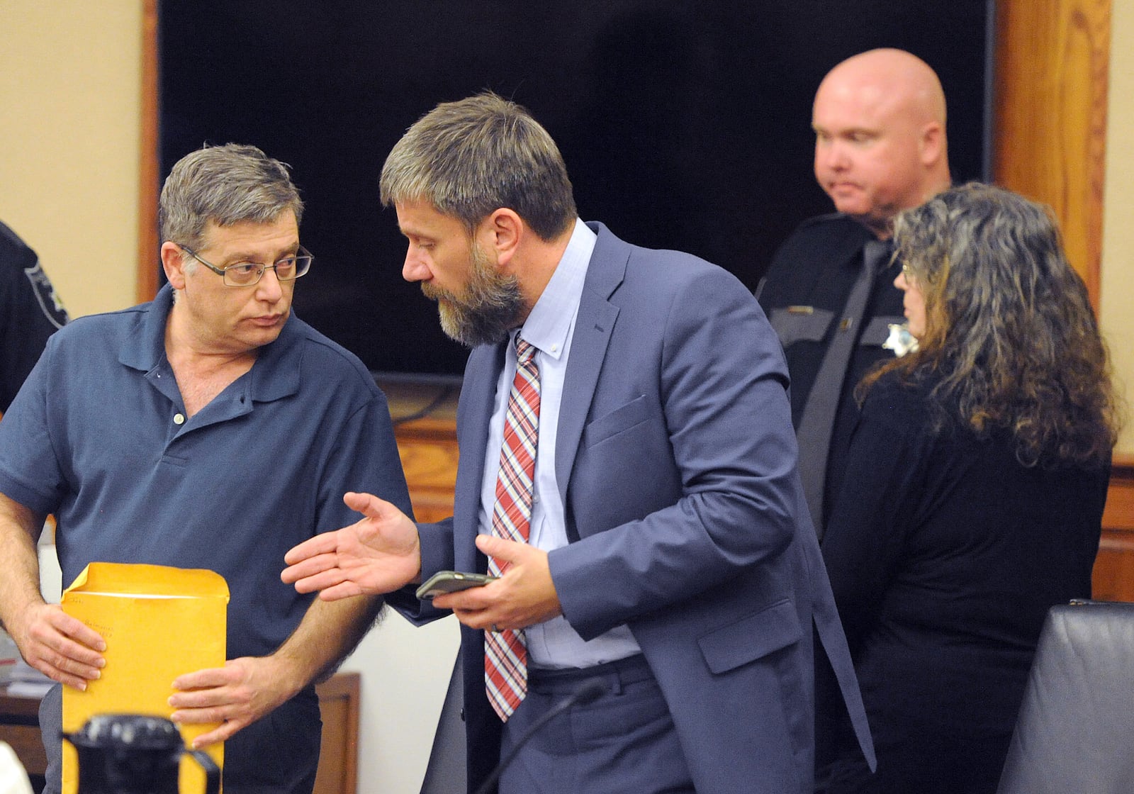 FILE - Donald Lantz, left, speaks with his attorney John Balenovich as his wife Jeanne Whitefeather, right, leaves the courtroom in Kanawha County Circuit Court, Wednesday, Jan. 29, 2025, in Charleston, W.Va. (Christopher Millette/Charleston Gazette-Mail via AP, File)