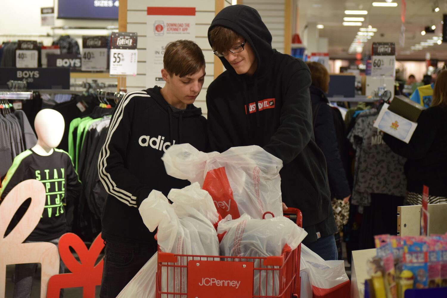 PHOTOS: Hundreds like up outside JCPenney for doorbusters, coupons