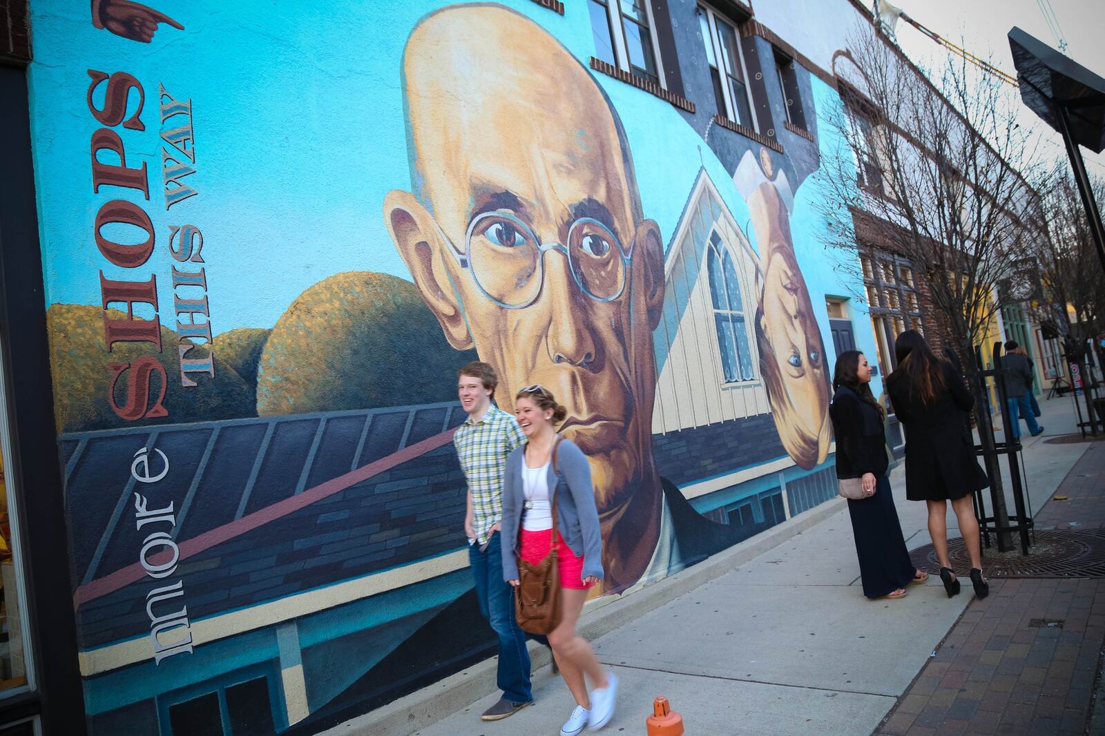 Large murals like this rendition of American Gothic grace the exterior walls of buildings in the Short North Arts District in Columbus. BAILEY LYTLE/SHORT NORTH ALLIANCE