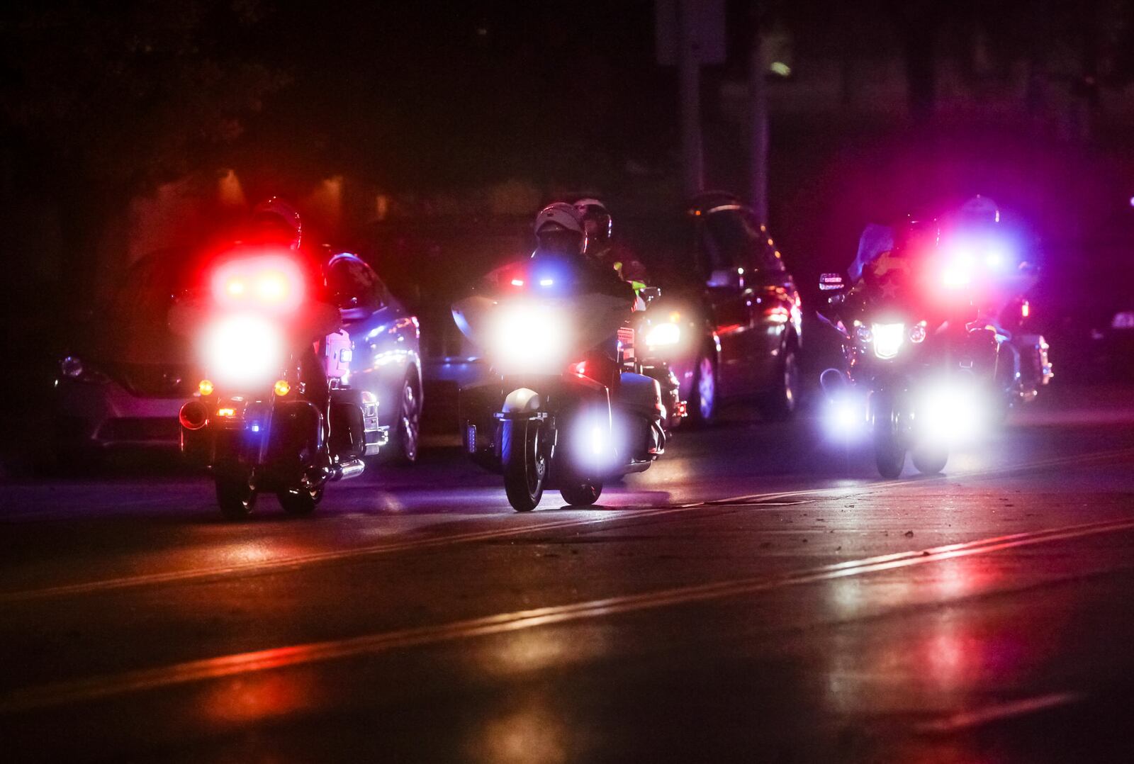 Dayton Police Det. Jorge Del Rio, who died Thursday after he was shot Monday night in the line of duty, was transported from Grandview Hospital to Montgomery County Coroner's office in a Dayton. People lined the entrance along West Third Street for the processional lead by fellow Dayton police officers. NICK GRAHAM/STAFF