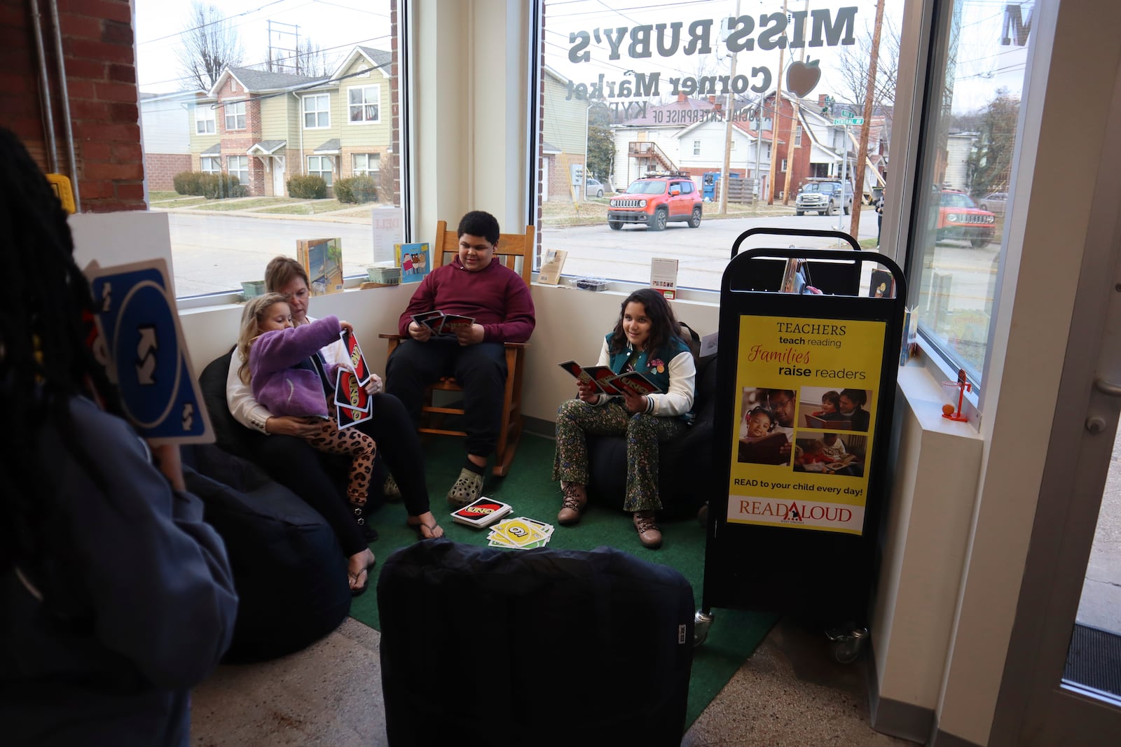 Children play with Uno cards at Keep Your Faith Corporation’s Miss Ruby’s Corner Store in Charleston, W.Va. on Tuesday, Feb. 4, 2025. (AP Photo/Leah Willingham)