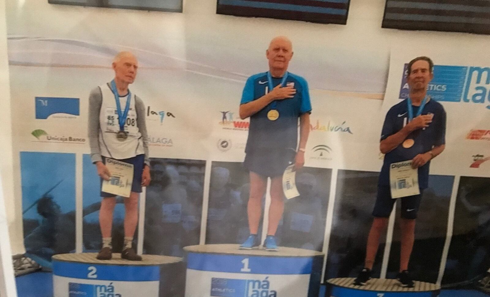 Bob Arledge (center) on the medal stand after he won the World Masters Track and Field Championships pole vaulting competition in Malaga, Spain five years ago at age 85. CONTRIBUTED