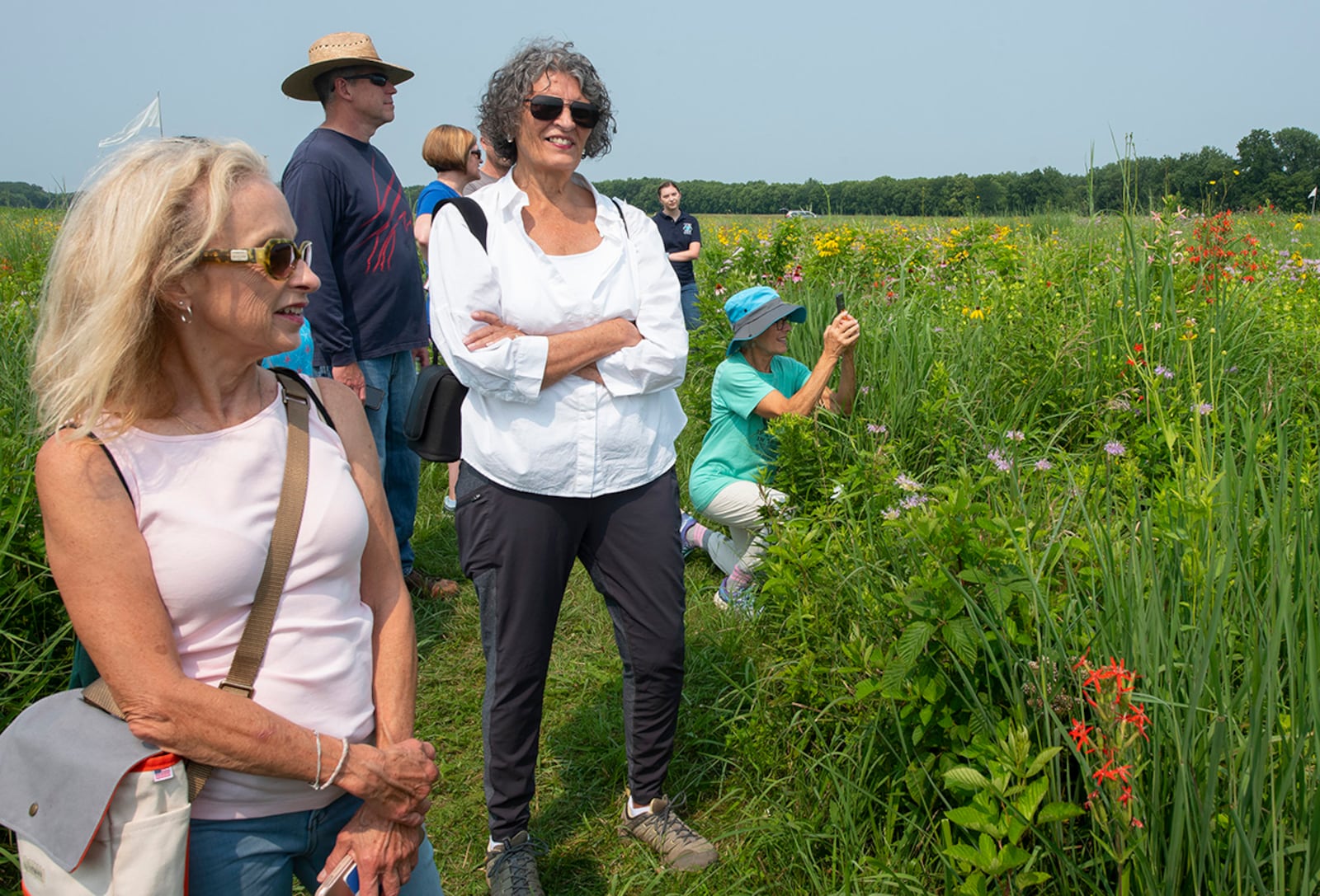 Participants in a nature walk, sponsored by the 88th Civil Engineer Group’s Environmental Branch, look at wildflowers and pollinators July 19 on Huffman Prairie at Wright-Patterson Air Force Base. The base owns the prairie land, but it is open to the public. It sits next to Huffman Prairie Flying Field, which is overseen by the National Park Service. U.S. AIR FORCE PHOTO/R.J. ORIEZ