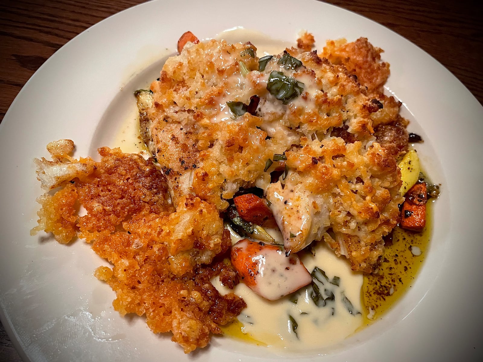 Pictured is a pan-seared halibut with parmesan crust made by executive chef Nathaniel Young at Jay's Seafood. NATALIE JONES/STAFF