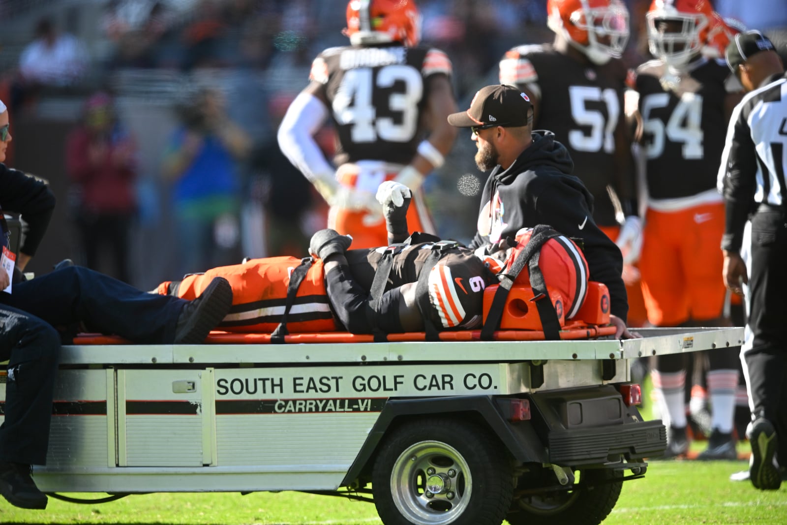 Cleveland Browns linebacker Jeremiah Owusu-Koramoah (6) is taken off the field during the second half of an NFL football game against the Baltimore Ravens in Cleveland, Sunday, Oct. 27, 2024. (AP Photo/David Richard)