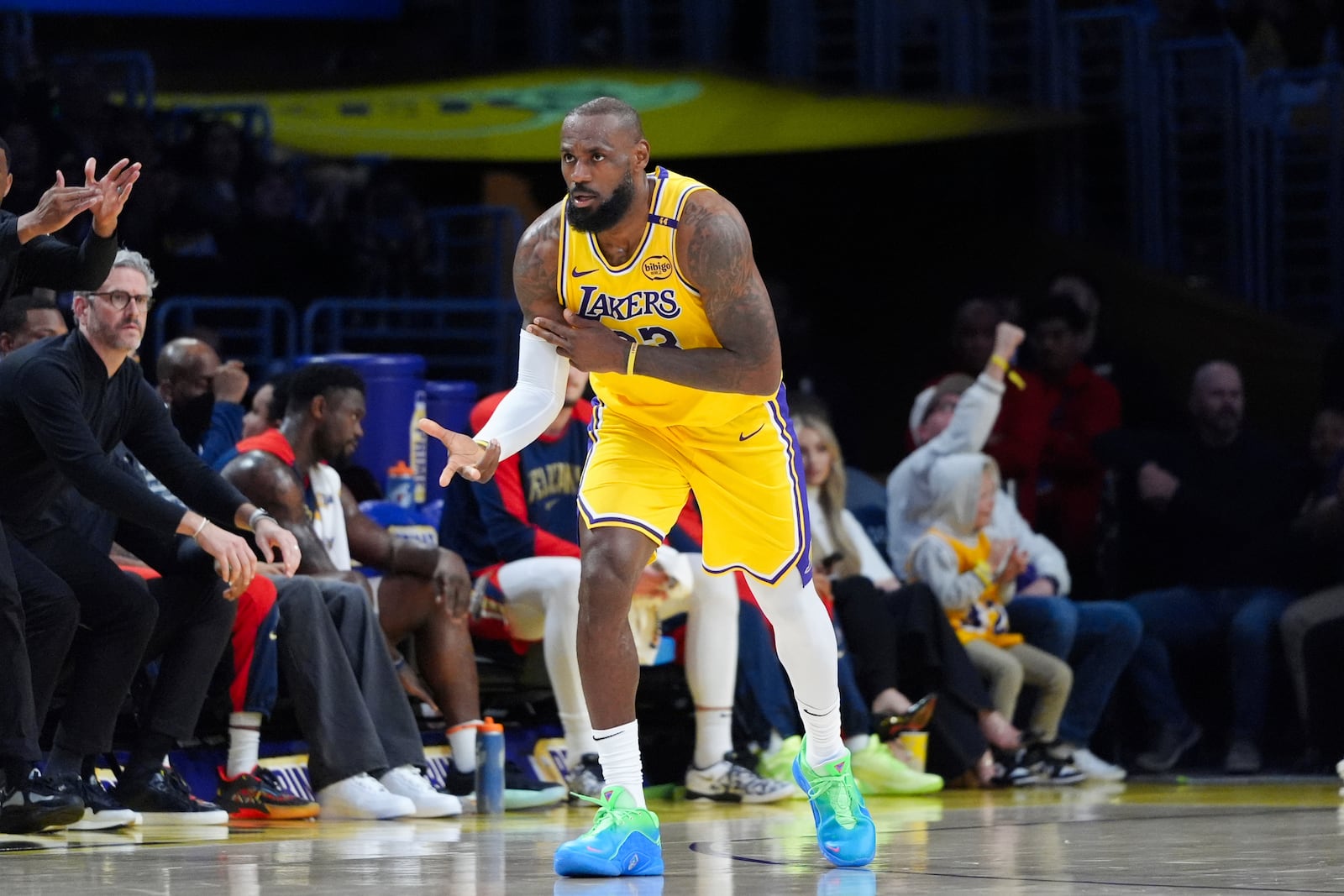 Los Angeles Lakers' LeBron James celebrates his three-point basket against the New Orleans Pelicans during the first half of an NBA basketball game Tuesday, March 4, 2025, in Los Angeles. (AP Photo/Jae C. Hong)