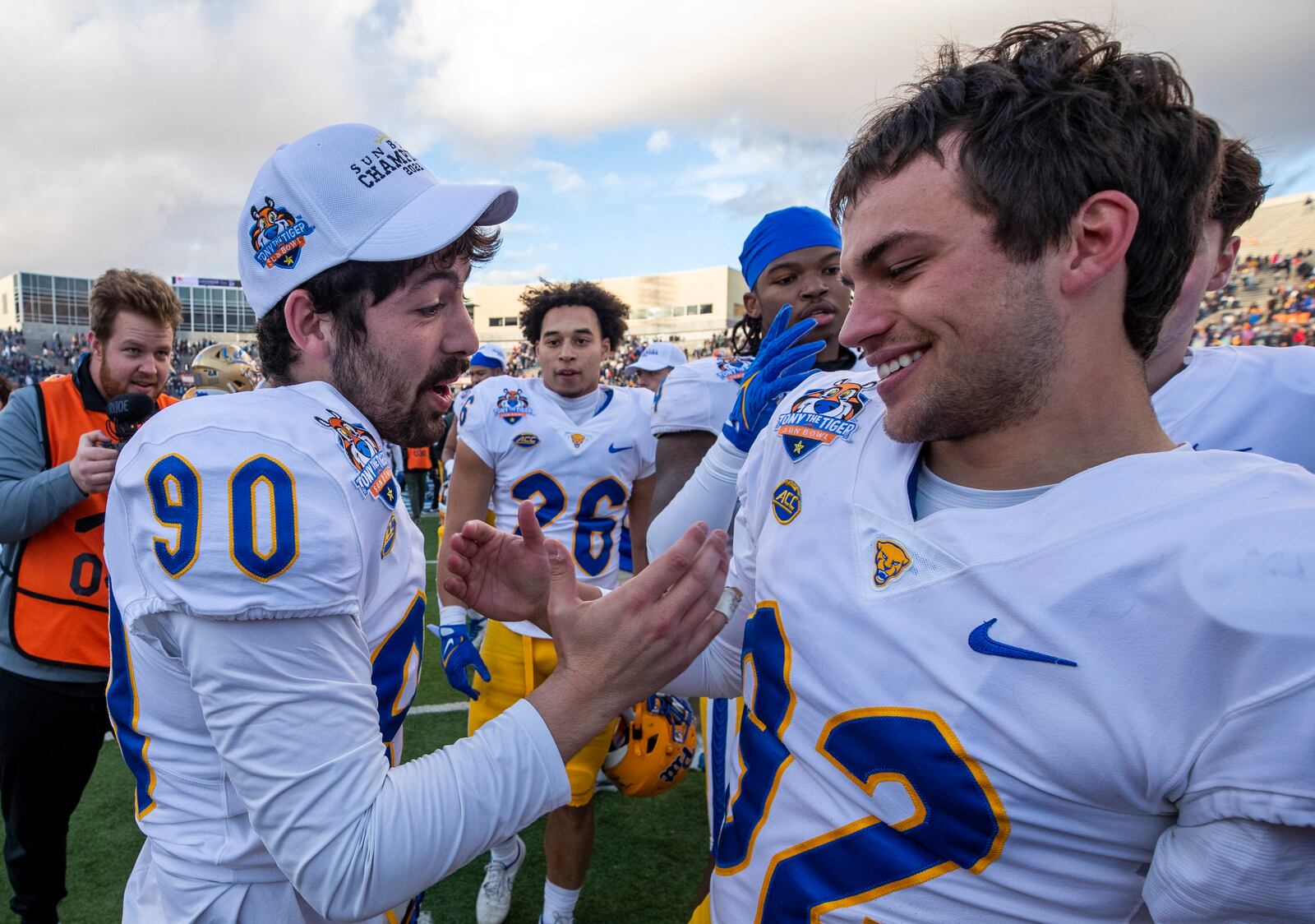 Pittsburgh place-kicker Ben Sauls (90) and punter Cam Guess (92) celebrate after the team's win over UCLA in the Sun Bowl NCAA college football game Friday, Dec. 30, 2022, in El Paso, Texas. (AP Photo/Andres Leighton)