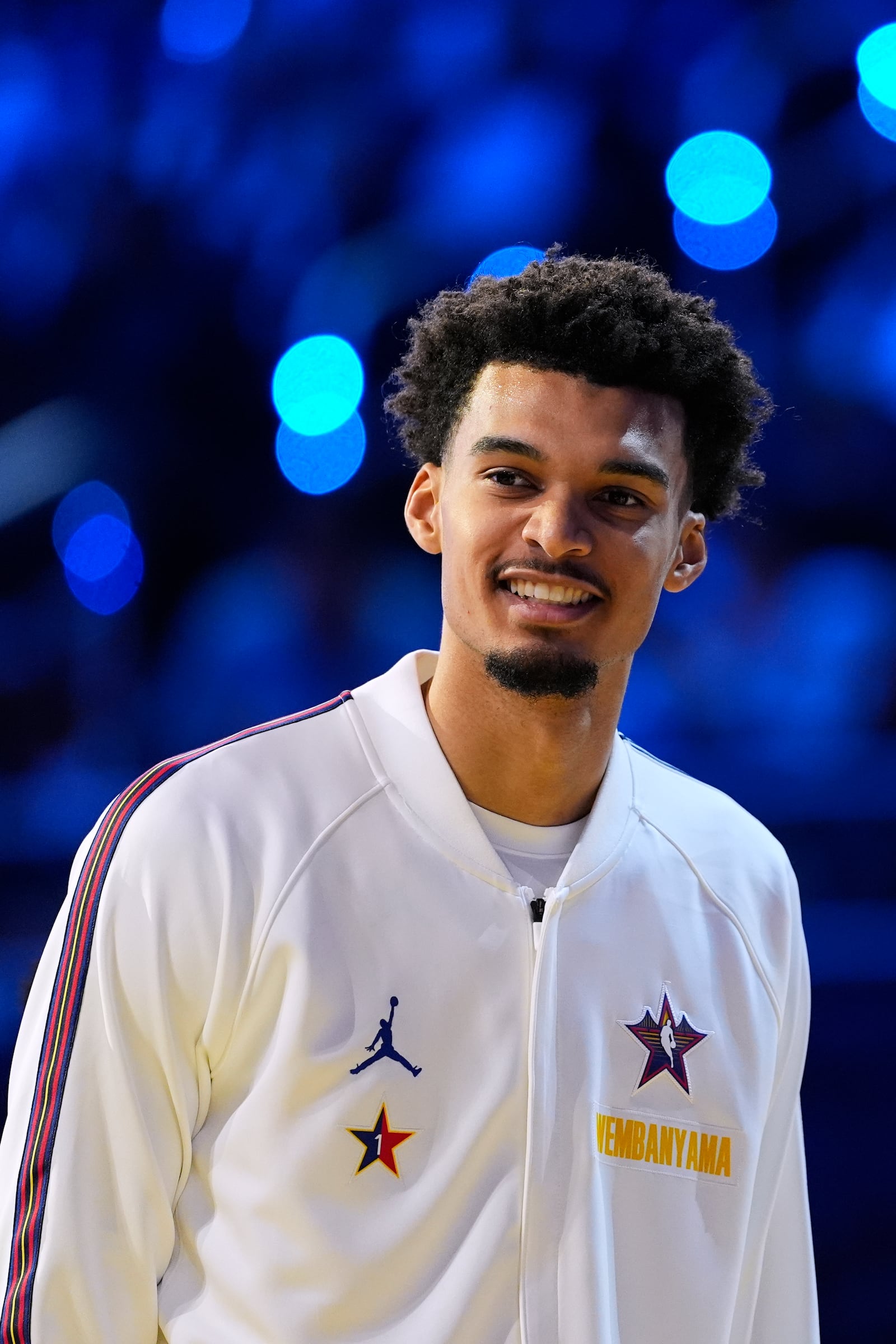 San Antonio Spurs center Victor Wembanyama smiles before the NBA All-Star basketball game Sunday, Feb. 16, 2025, in San Francisco. (AP Photo/Godofredo A. Vásquez)