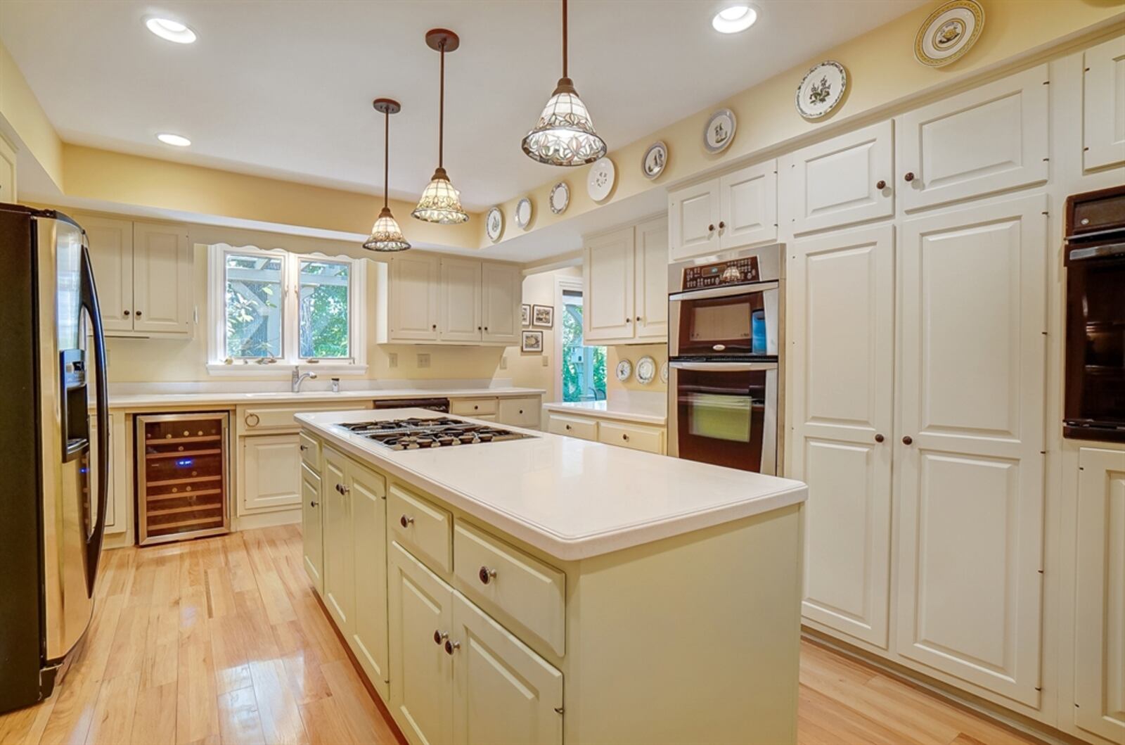 The kitchen is centrally located with an island and double wall ovens. CONTRIBUTED