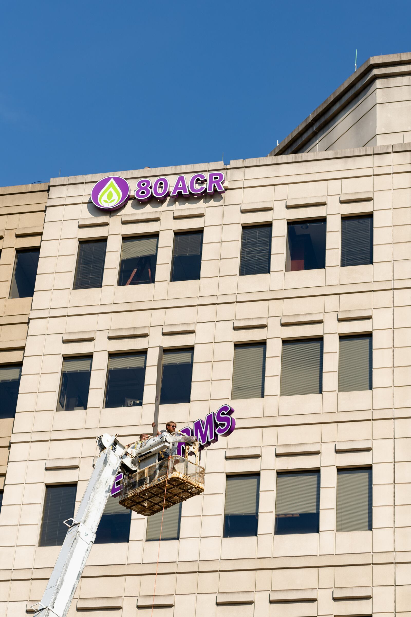 A sign for 80 Acres Farms, now based in Hamilton, in the city-government tower, went up last summer, joining that of ODW Logistics, which has had a sign on the building for years. PROVIDED