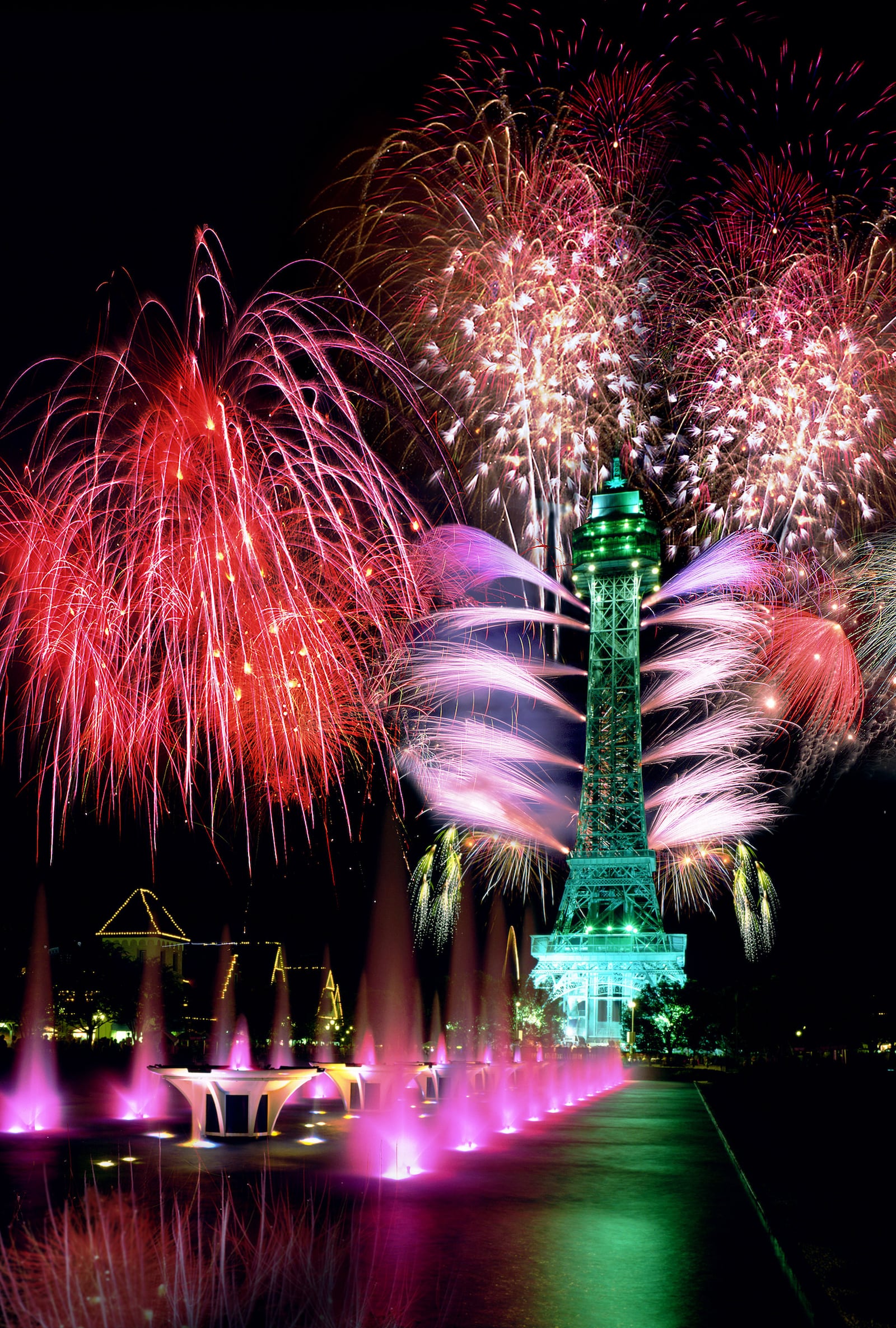 Kings Island amusement park lights up with fireworks at night by the park's replica of the famed Eiffel Tower. The attraction is located about 21 miles north of Cincinnati in Mason, Ohio.