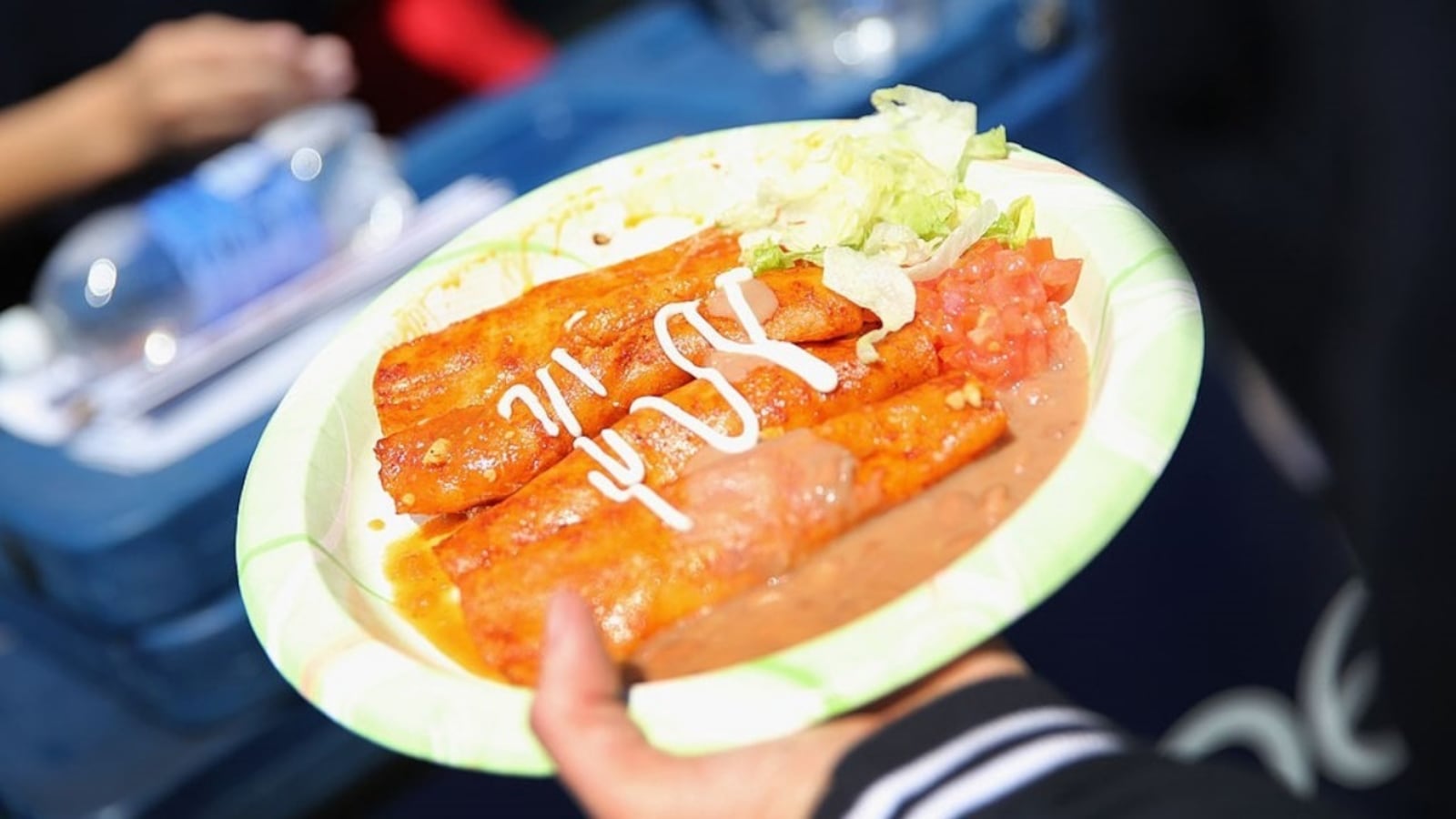 DENVER, CO : A plate of enchiladas is carried through a Cinco de Mayo festival on May 4, 2013 in Denver, Colorado. Cinco de Mayo observes the victory of the Mexican army over French forces on May 5, 1862 in the town of Puebla, Mexico. The festival celebrates Mexican culture and is one of the most popular annual Latino events in the United States. 