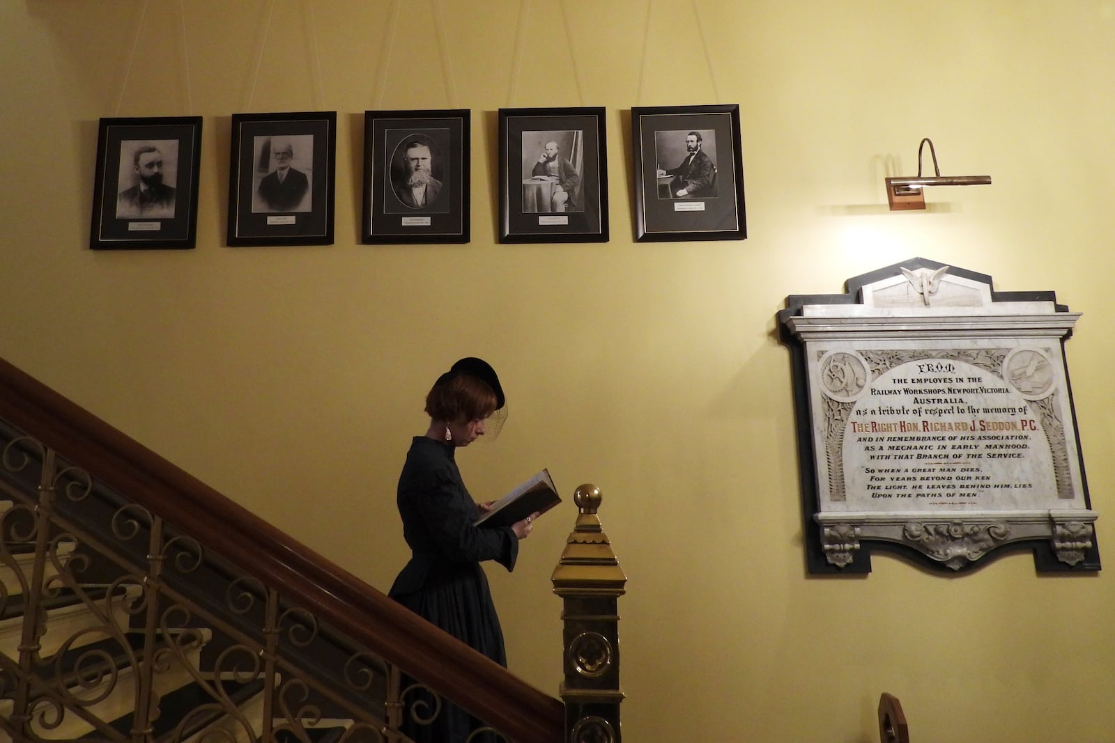 A tour guide at New Zealand's Parliament gives a spooky tour of the historical Parliament library, built in 1883 and rumored to be haunted, in Wellington, Thursday, March 20, 2025. (AP Photo/Charlotte Graham-McLay)