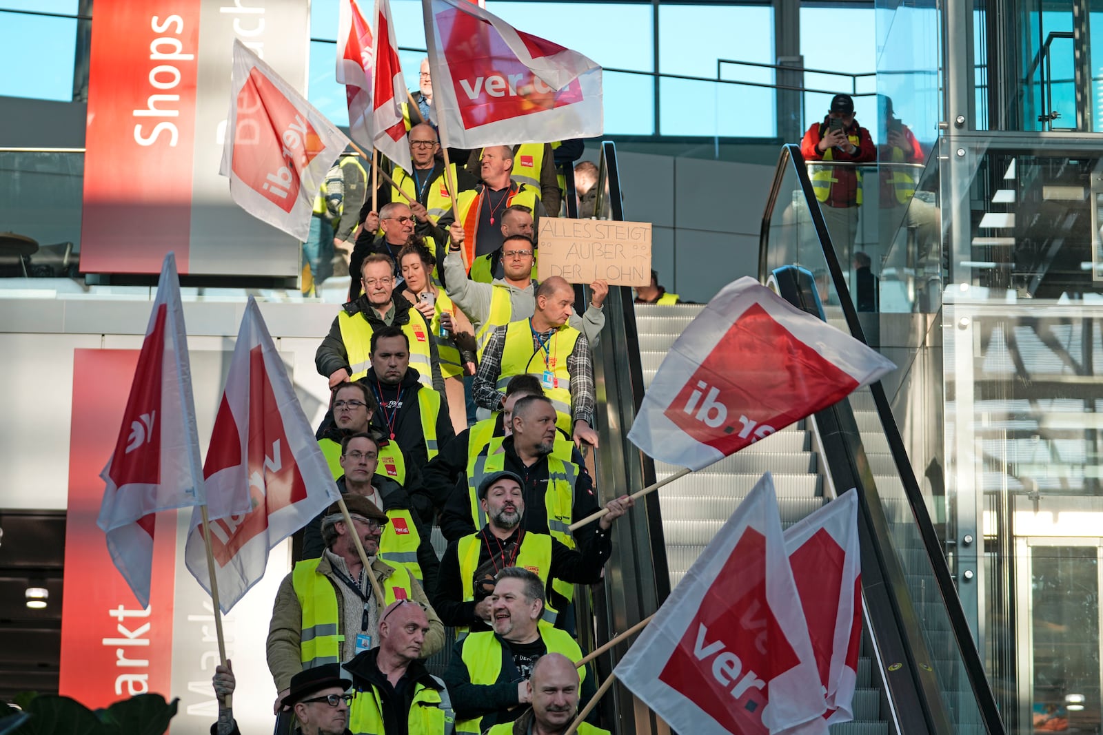 Airport workers protest during a strike of the union ver.di at the airport in Duesseldorf, Germany on Monday, March 10, 2025, when all major airports in Germany went on a warning strike. (AP Photo/Martin Meissner)