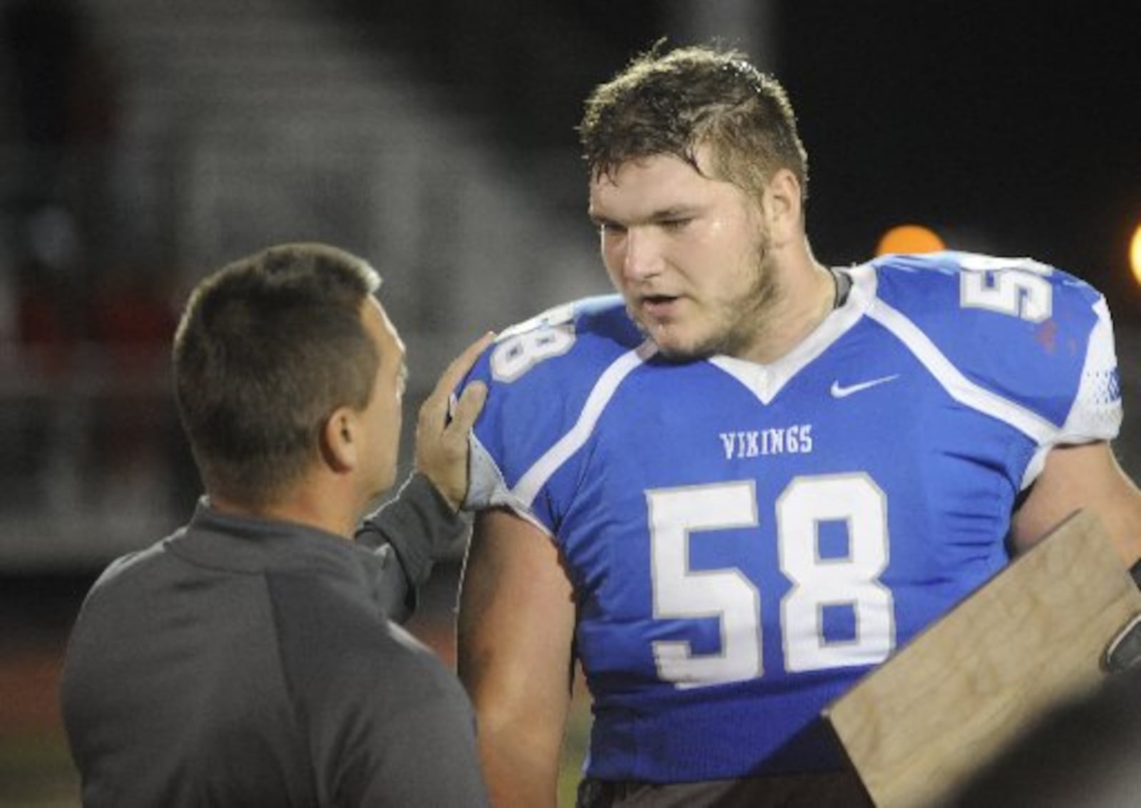 Miamisburg sr. OL Josh Myers accepts a regional runner-up trophy. Cincinnati La Salle defeated Miamisburg 45-14 in a D-II, Region 8 high school football final at Mason on Friday, Nov. 18, 2016. MARC PENDLETON / STAFF