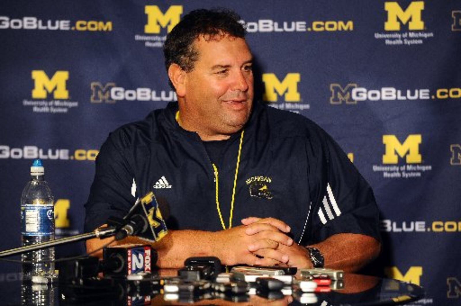 Michigan head football coach Brady Hoke speaks during a news conference following the team's first NCAA college football practice, Monday, Aug. 8, 2011, in Ann Arbor, Mich. (AP Photo/AnnArbor.com, Melanie Maxwell)