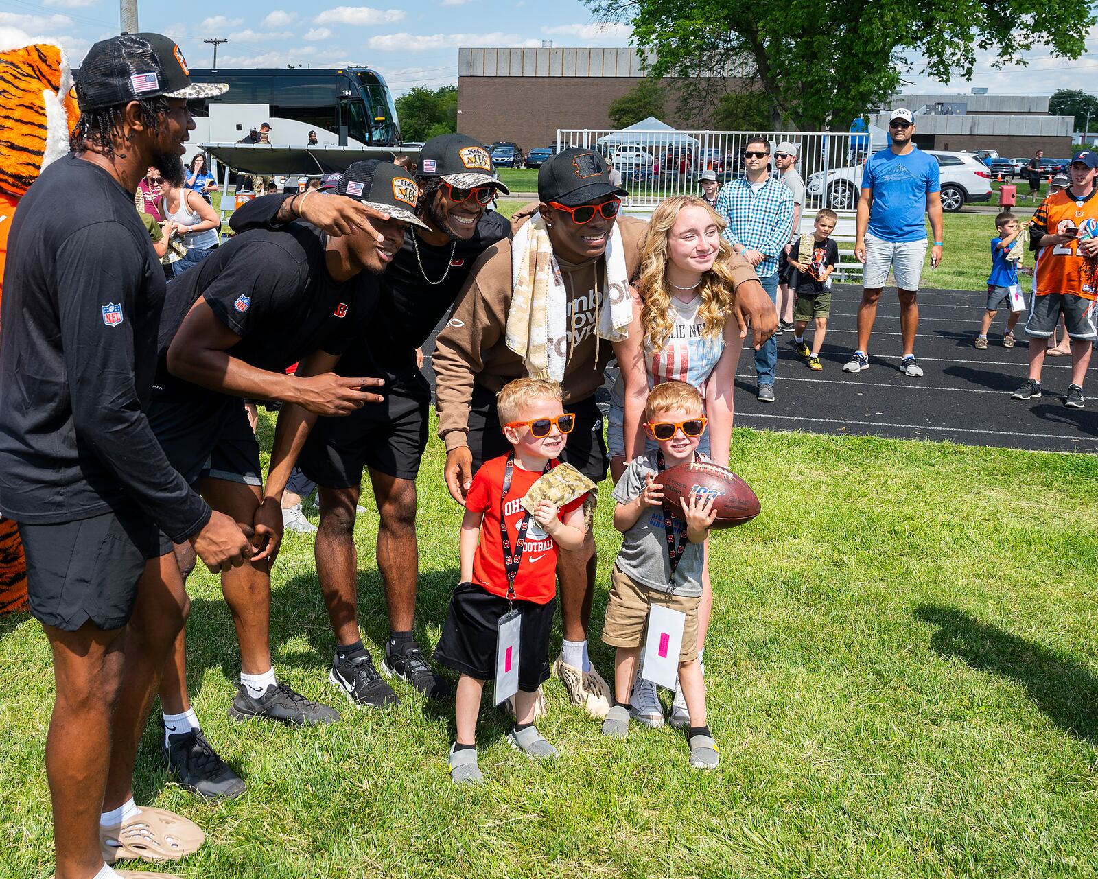 A group of Cincinnati Bengal rookies poses with military family members after a USO-sponsored Bengals’ skill clinic June 3 at Wright-Patterson Air Force Base. U.S. Air Force photo / R.J. Oriez