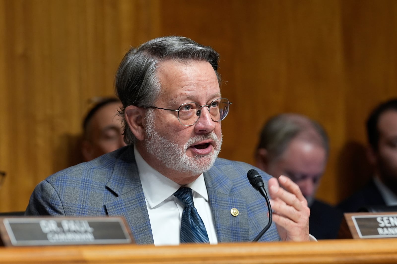 Ranking Member Gary Peters, D-Mich., speaks at the Senate Homeland Security and Governmental Affairs Committee confirmation hearing for South Dakota Gov. Kristi Noem, President-elect Donald Trump's nominee to be Secretary of Homeland Security, at the Capitol in Washington, Friday, Jan. 17, 2025. (AP Photo/Susan Walsh)