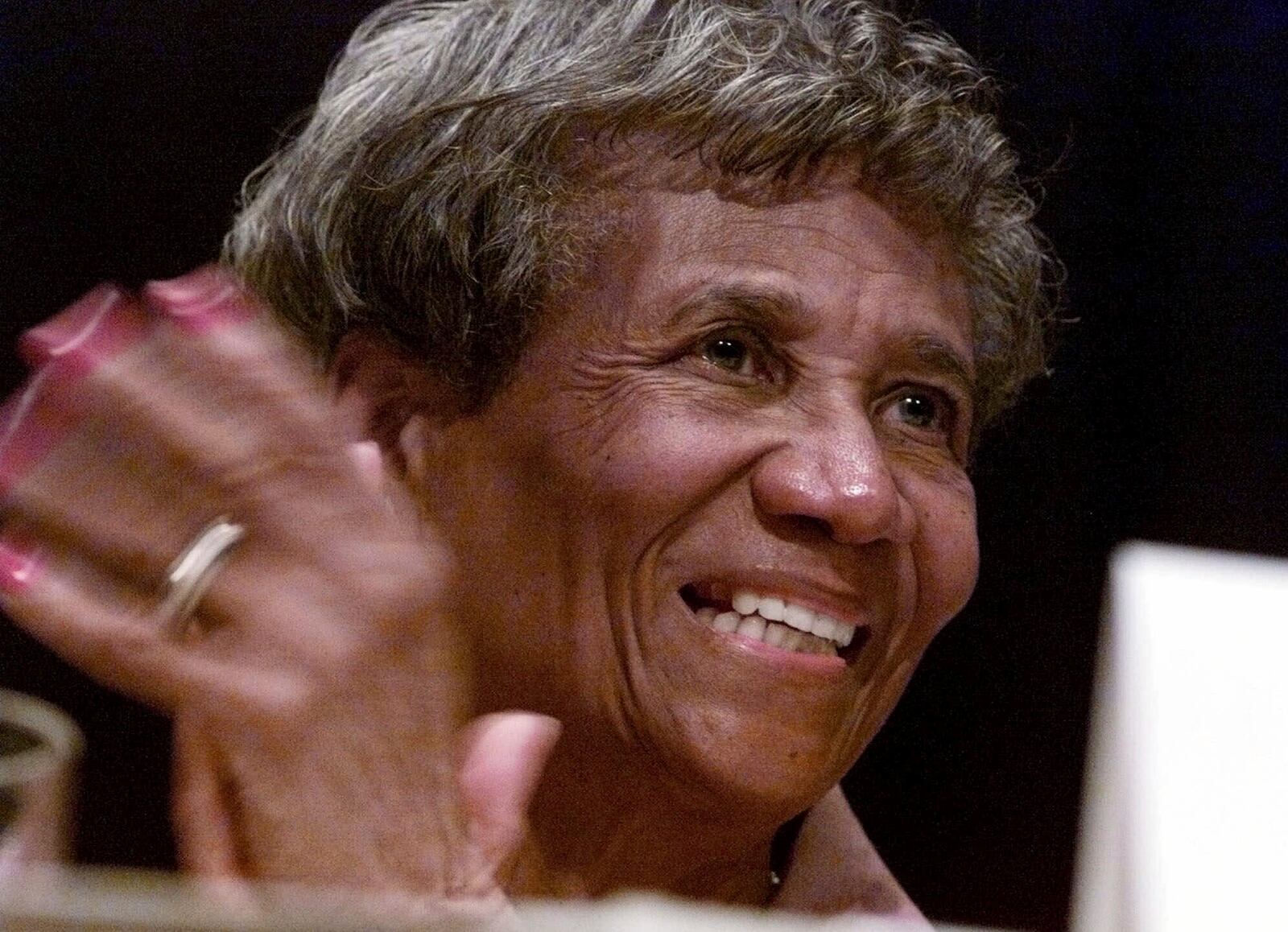 FILE - Hazel Dukes, member of the national board of directors of the NAACP and its New York chapter president, applauds a speech at the 90th annual NAACP convention in New York, July 12, 1999. (AP Photo/Richard Drew, File)