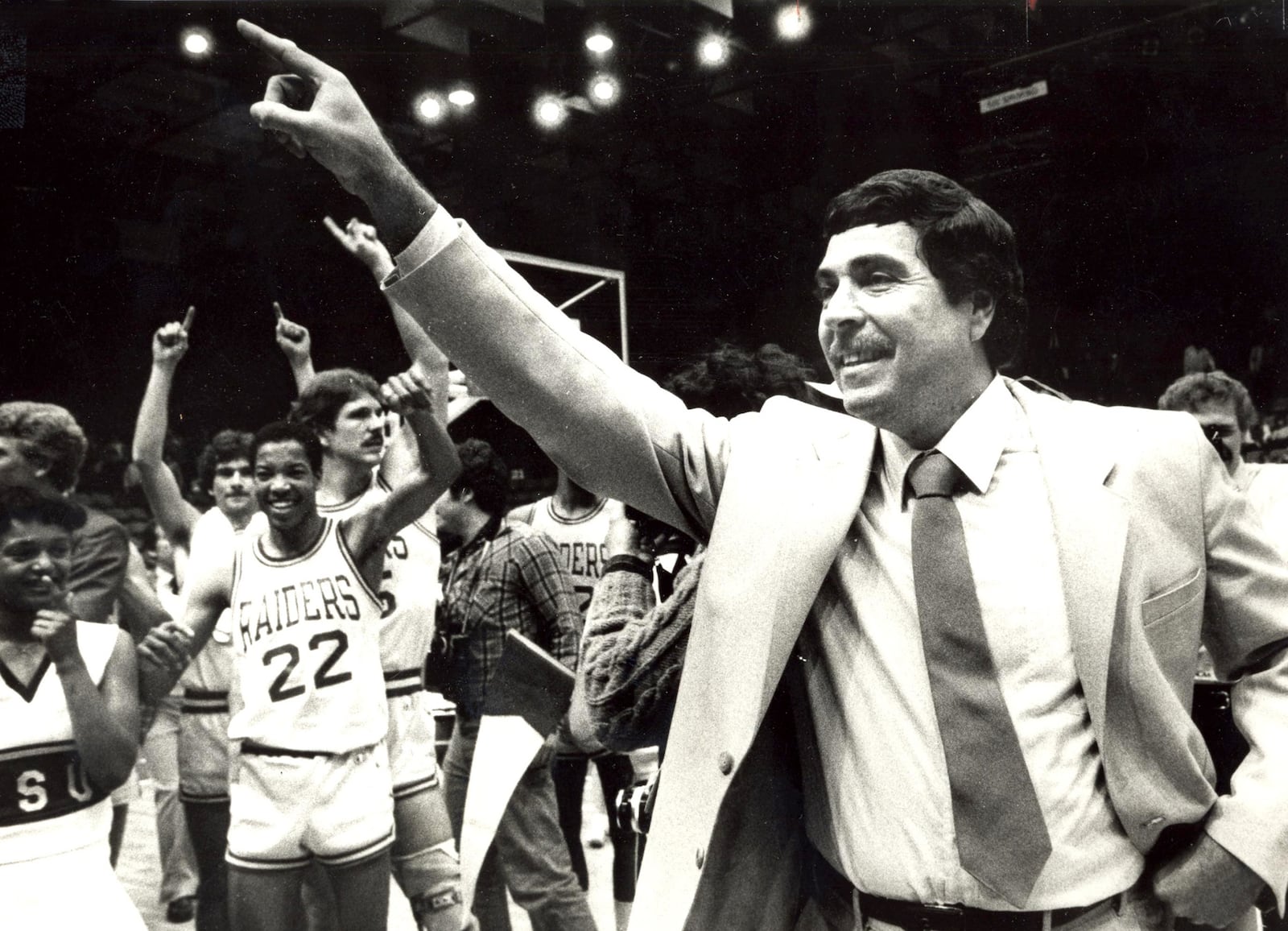 Wright State University coach Ralph Underhill celebrates after the Raiders won the 1983 DII National Championship.  DAYTON DAILY NEWS ARCHIVE