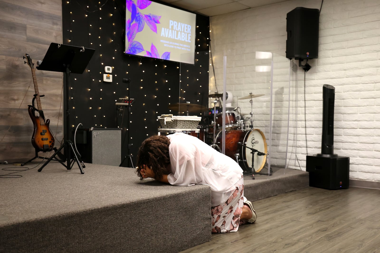 Janett Laguna prays prior to services at Casa de Adoracion, Sunday, Oct. 27, 2024 in Phoenix. (AP Photo/Chris Coduto)