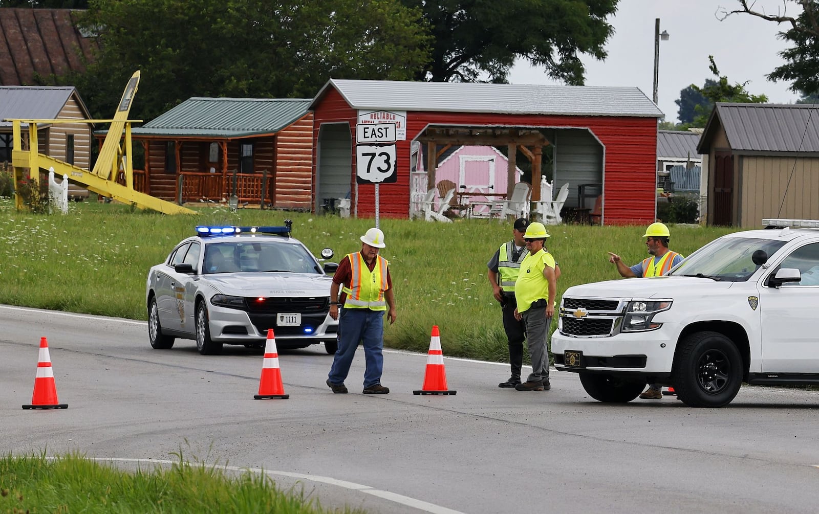 Roads are blocked in the area Thursday, Aug. 11, 2022, after an armed man tried to breach the Cincinnati FBI office and fled north to Clinton County. NICK GRAHAM/STAFF