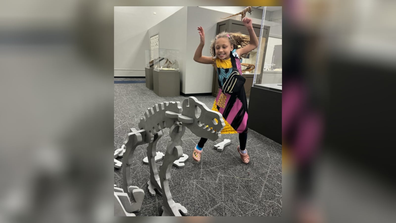 Pamela Chandler's daughter Jasmine enjoys a dinosaur exhibit at the Boonshoft Museum of Discovery. CONTRIBUTED