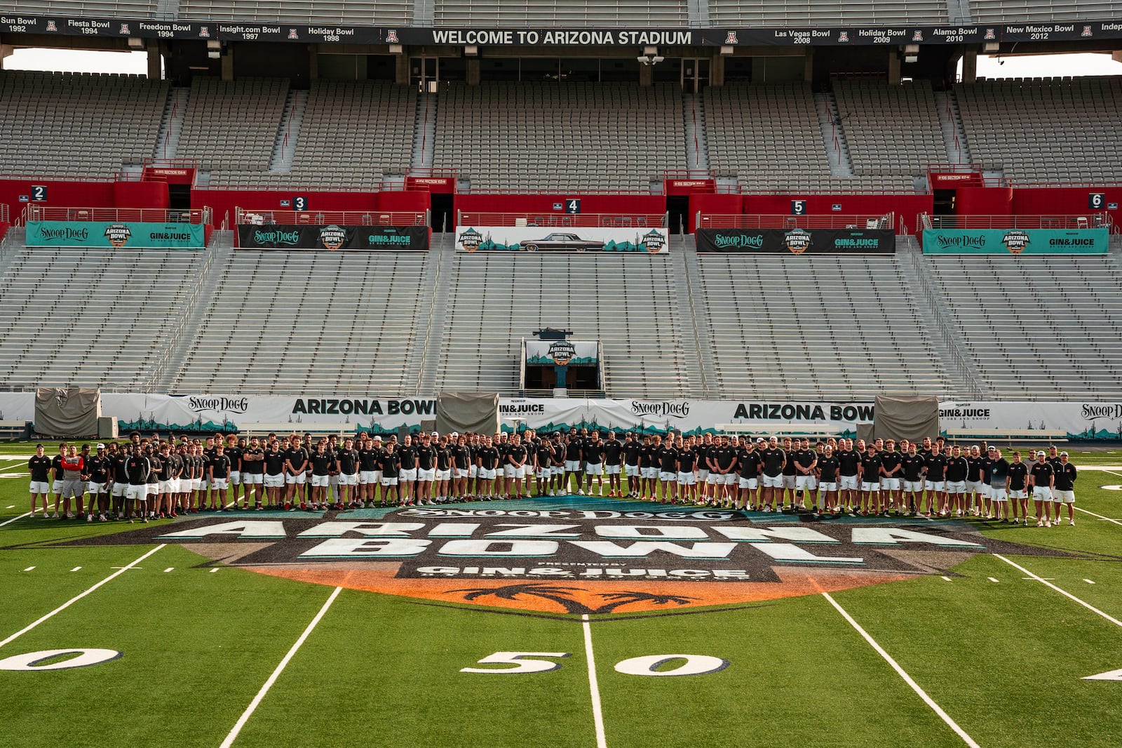 The Miami football team takes a team photo prior to competing in Saturday's Snoop Dogg Arizona Bowl. Miami Athletics photo