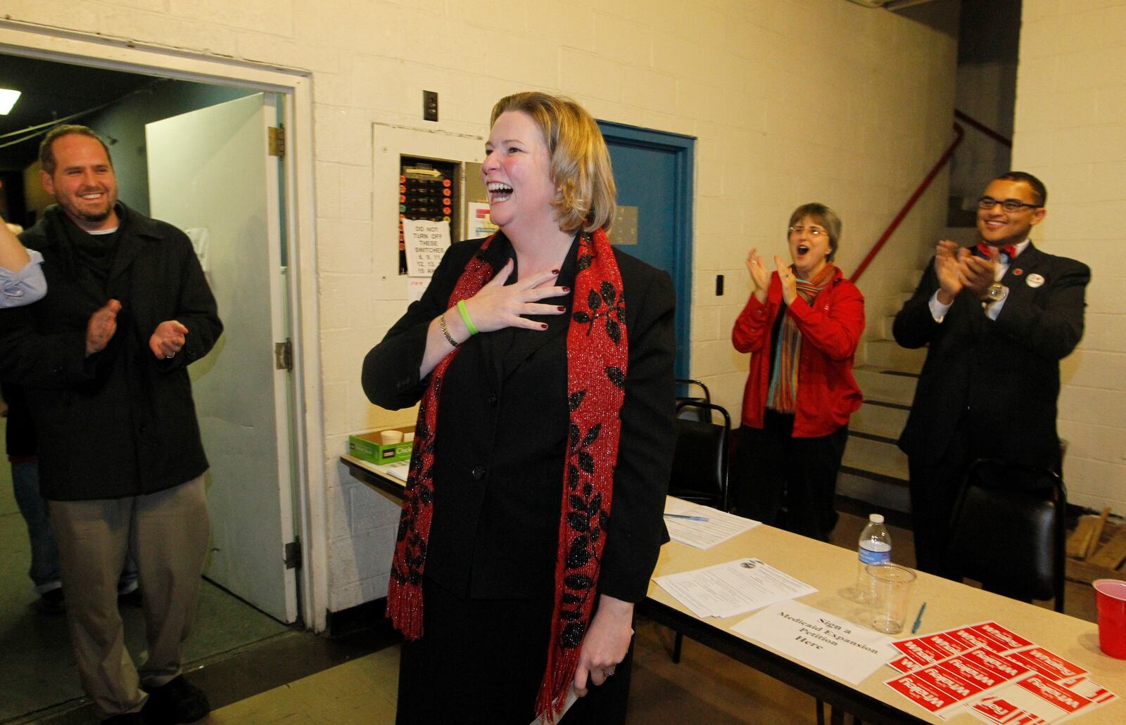 Mayor elect Nan Whaley is greeted by supporters on Election Night in 2013 at Democratic Headquarters in Dayton during her successful initial run for mayor. LISA POWELL / STAFF