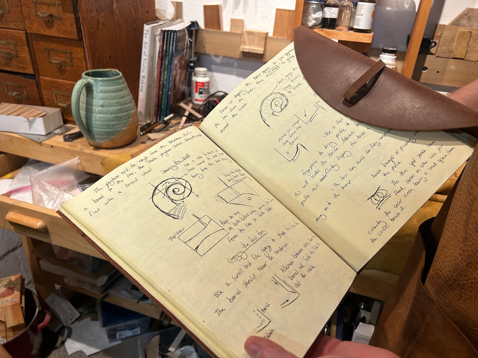 The sketchbook Joel Thompson kept at the Chicago School of Violin Making is still a resource. “Everything about the violin has a dual function. It’s supposed to be really pretty and functional at the same time. The people who let the cement dry on their designs were obsessed with proportions.”