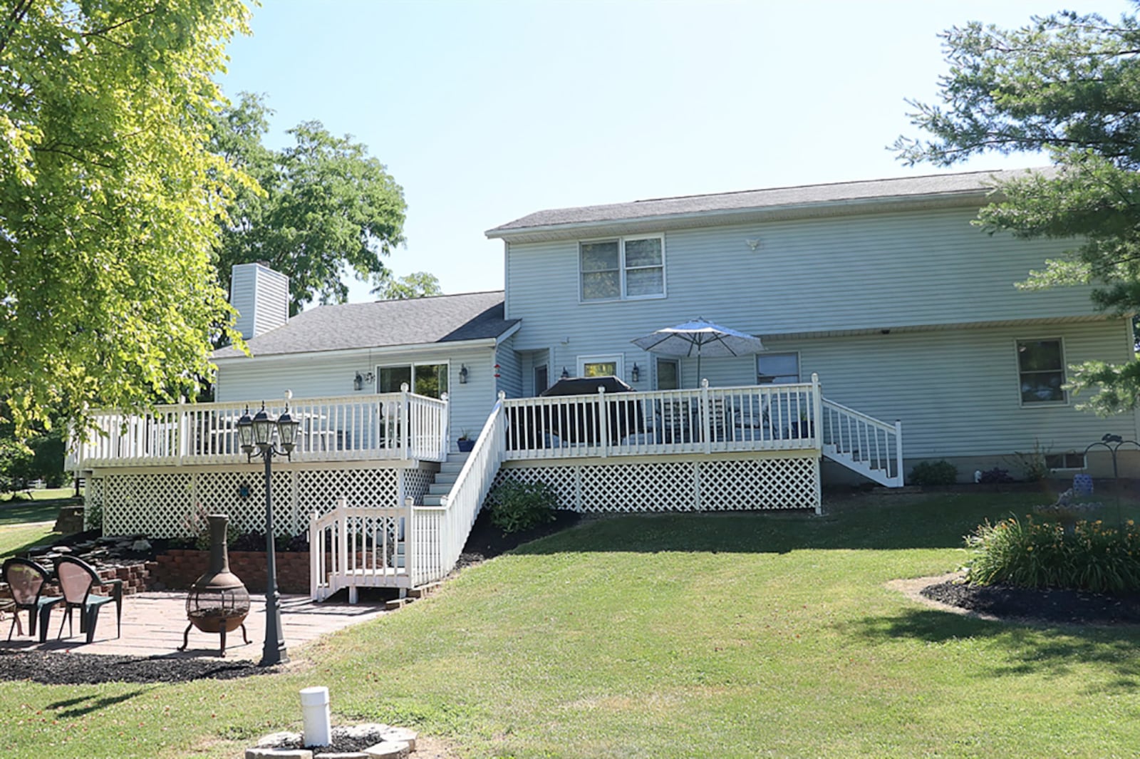 At the back, a multi-level wood deck overlooks the back yard, which includes a storage shed. Steps from the deck lead down to a tree-shaded brick patio with water feature that includes a small fish pond. CONTRIBUTED PHOTO BY KATHY TYLER