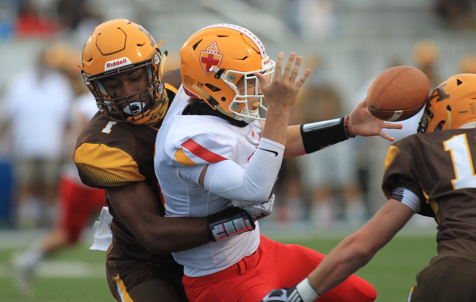 Alter's C.J. Hicks sacks Fenwick's Braden Listermann and forces a fumble that is recovered for a touchdown on Friday, Sept. 11, 2020, at Roush Stadium in Kettering. David Jablonski/Staff