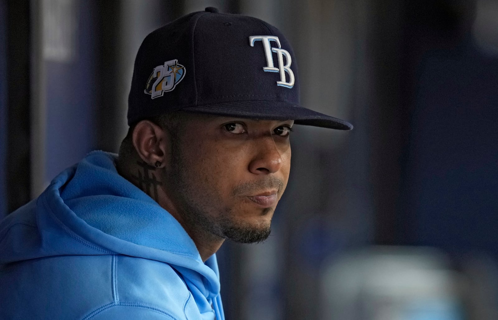 FILE - Tampa Bay Rays shortstop Wander Franco watches from the dugout during the fifth inning of a baseball game against the Cleveland Guardians, Aug. 13, 2023, in St. Petersburg, Fla. (AP Photo/Chris O'Meara, File)