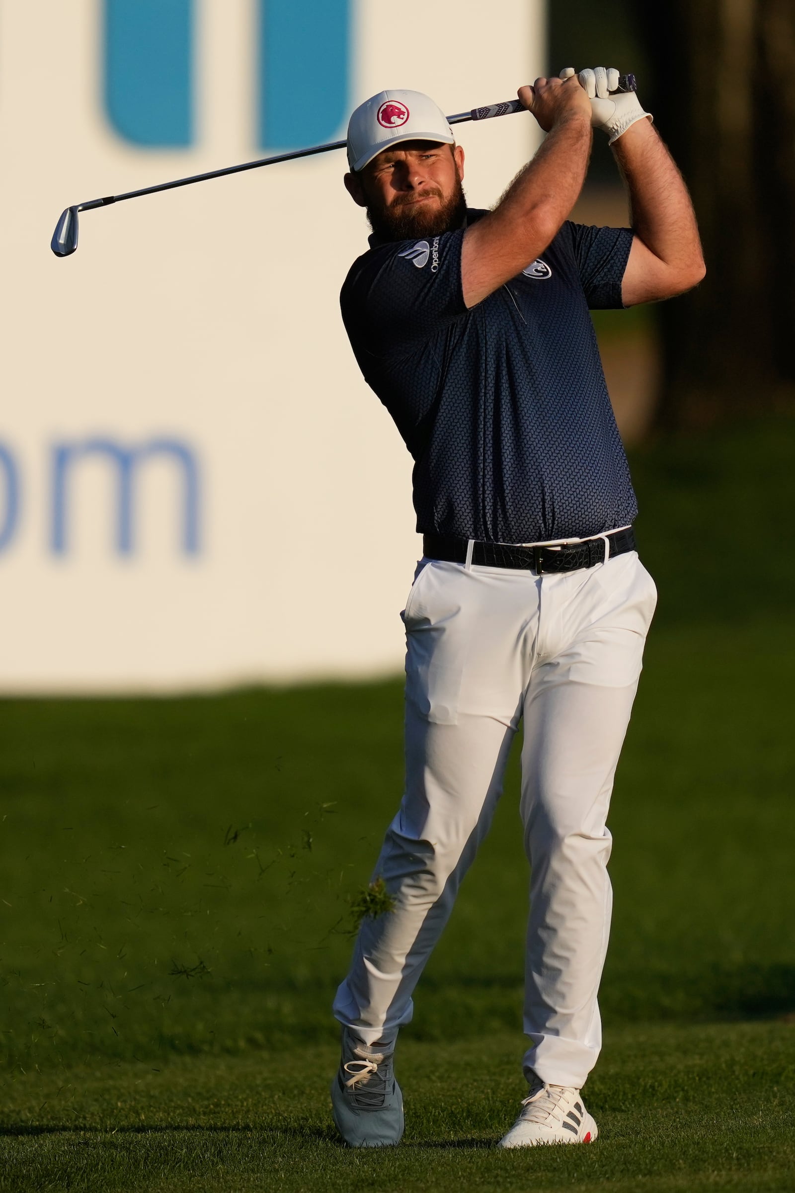 Tyrell Hatton of England plays his second shot on the 18th hole during the final round of the Dubai Desert Classic golf tournament, in Dubai, United Arab Emirates, Sunday, Jan. 19, 2025. (AP Photo/Altaf Qadri)