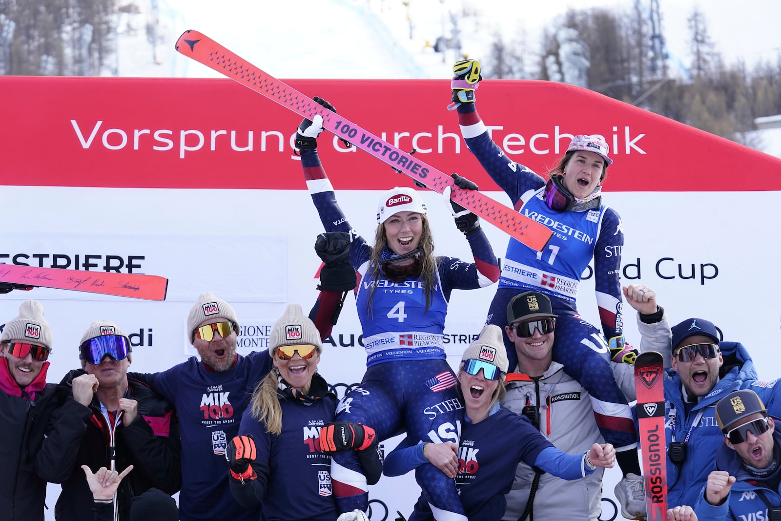 The winner United States' Mikaela Shiffrin and third placed United States' Paula Moltzan celebrate after an alpine ski, women's World Cup slalom, in Sestriere, Italy, Sunday, Feb. 23, 2025. (AP Photo/Piermarco Tacca)