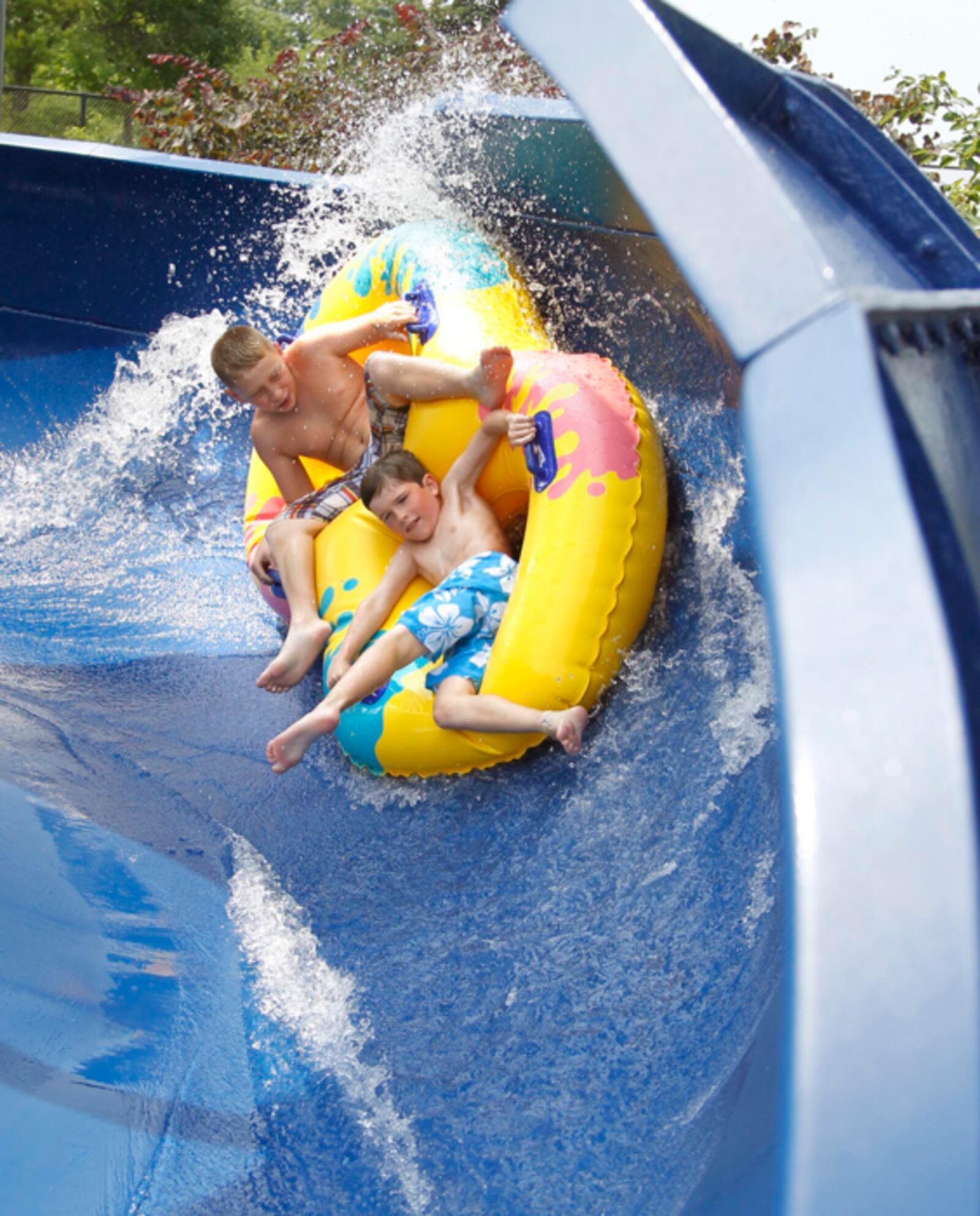 Josh Rohr, left, and Jordan Seifert kept cool on Friday, July 19 at the Sycamore Trails Aquatic Center in Miamisburg. The boys took many trips down the water slide. TY GREENLEES / STAFF