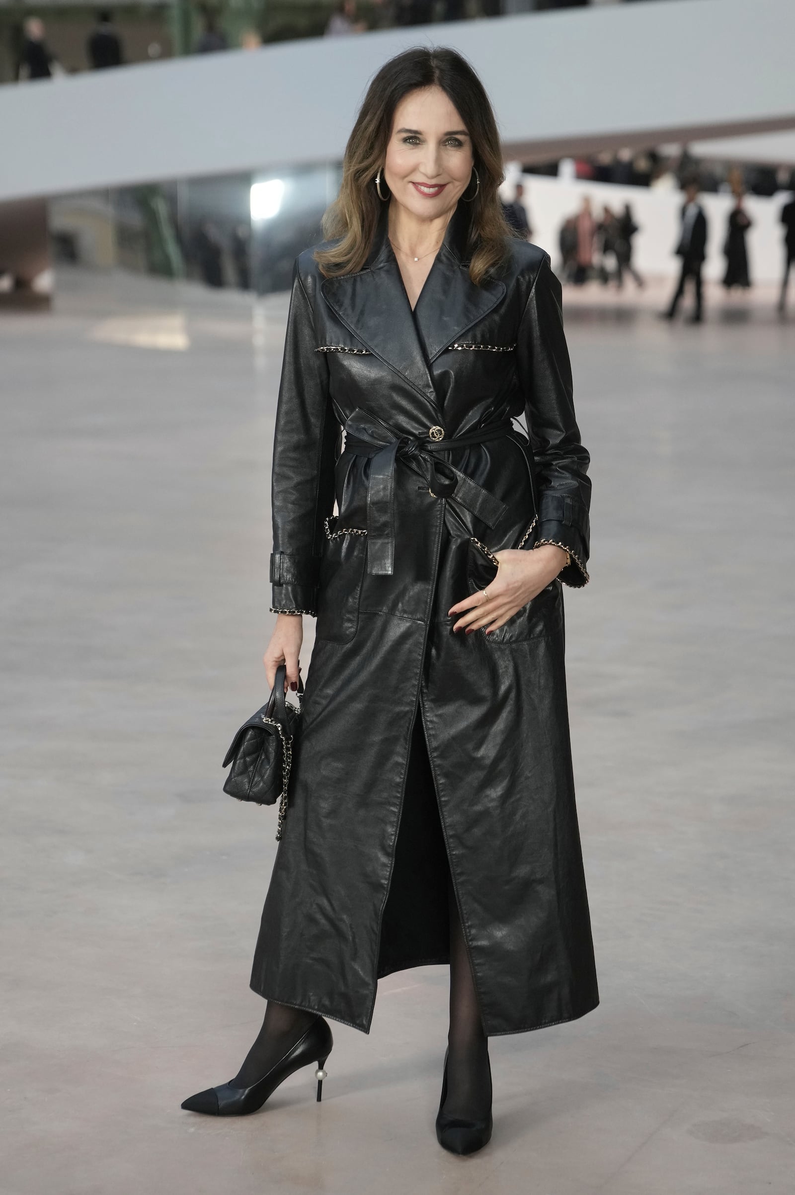 Elsa Zylberstein arrives at the Chanel Haute Couture Spring Summer 2025 collection, to be presented in Paris, Tuesday, Jan. 28, 2025. (AP Photo/Thibault Camus)