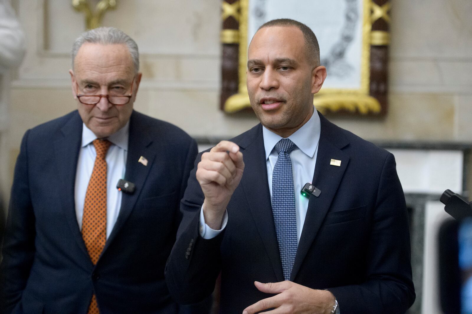 FILE - House Minority Leader Hakeem Jeffries, D-N.Y., right, is joined by Senate Minority Leader Chuck Schumer, D-N.Y., for a press conference in Statuary Hall at the Capitol, Feb. 12, 2025, in Washington. (AP Photo/Rod Lamkey, Jr., File)