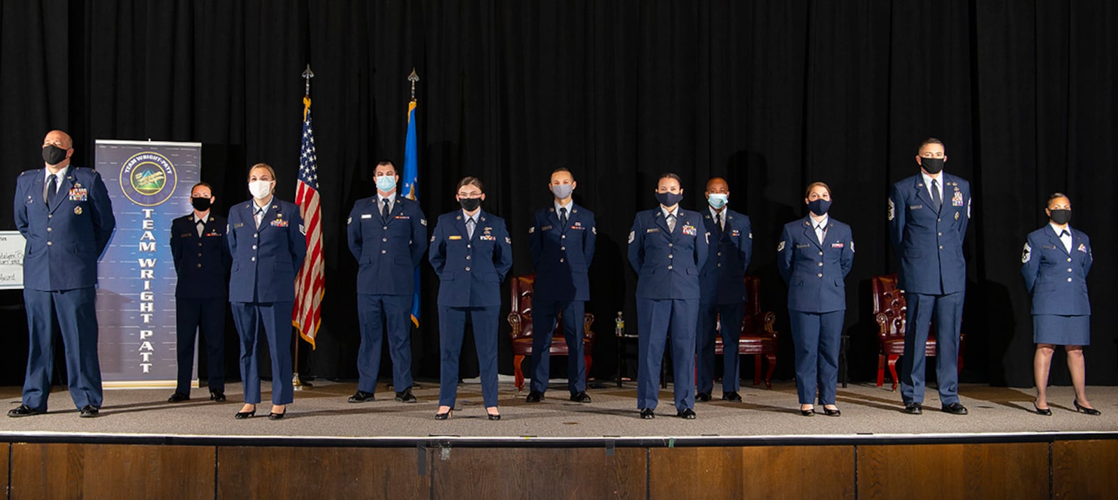 Eight Community College of the Air Force graduates pose with Col. Patrick Miller, 88th Air Base Wing and installation commander; Chief Master Sgt. Jason Shaffer, 88th ABW command chief; and Chief Master Sgt. Arwa Cavendar, 88th Medical Support Squadron superintendent, after their graduation ceremony Nov. 19 at the National Museum of the Air Force. Only eight of the 29 graduates were able to attend due to the pandemic and no guests were allowed. U.S. AIR FORCE PHOTO/R.J. ORIEZ