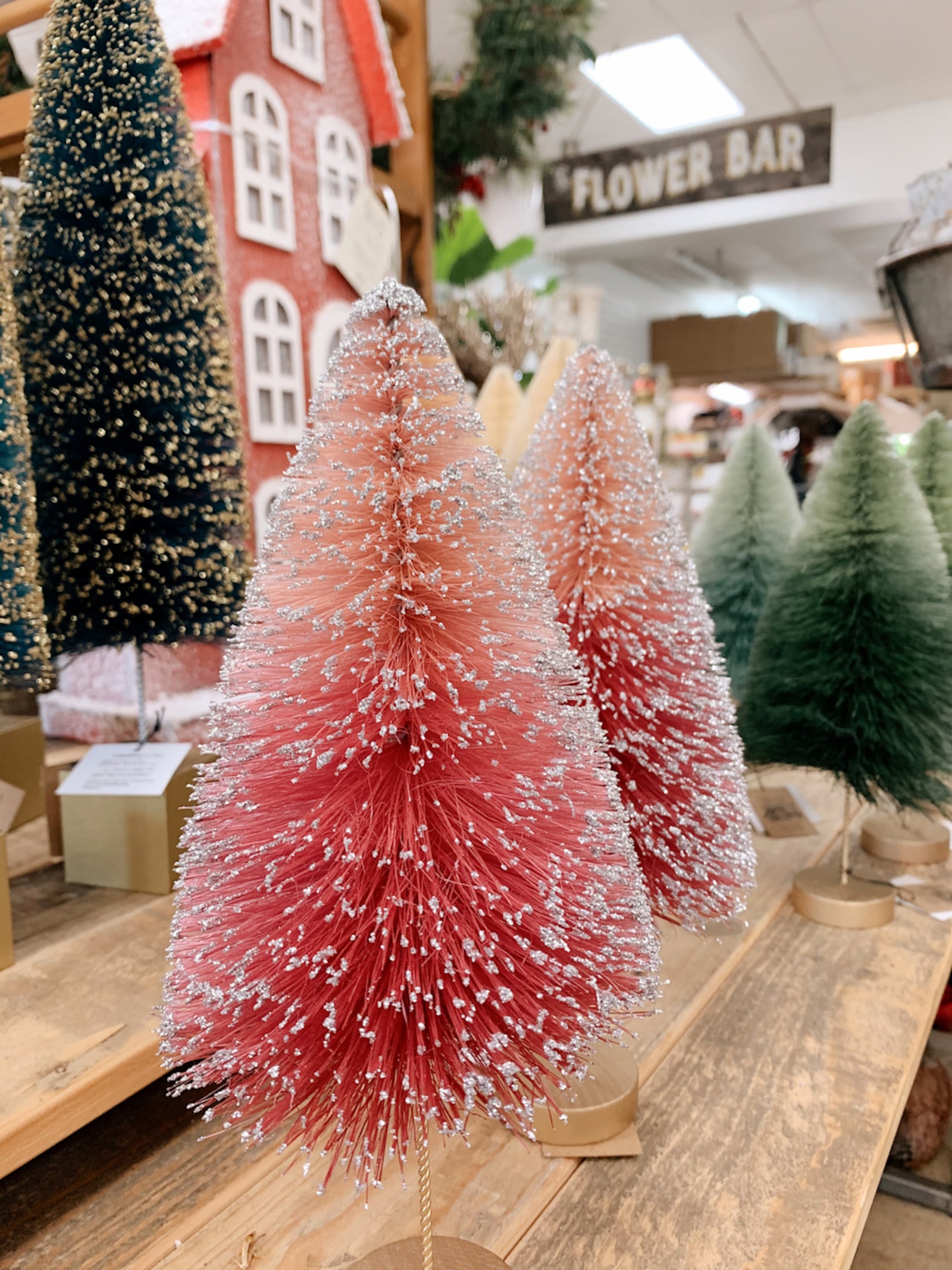 Think pink this holiday season when shopping for home decor: Bottle brush trees are an example of incorporating the less traditional color. iSTOCK/COX