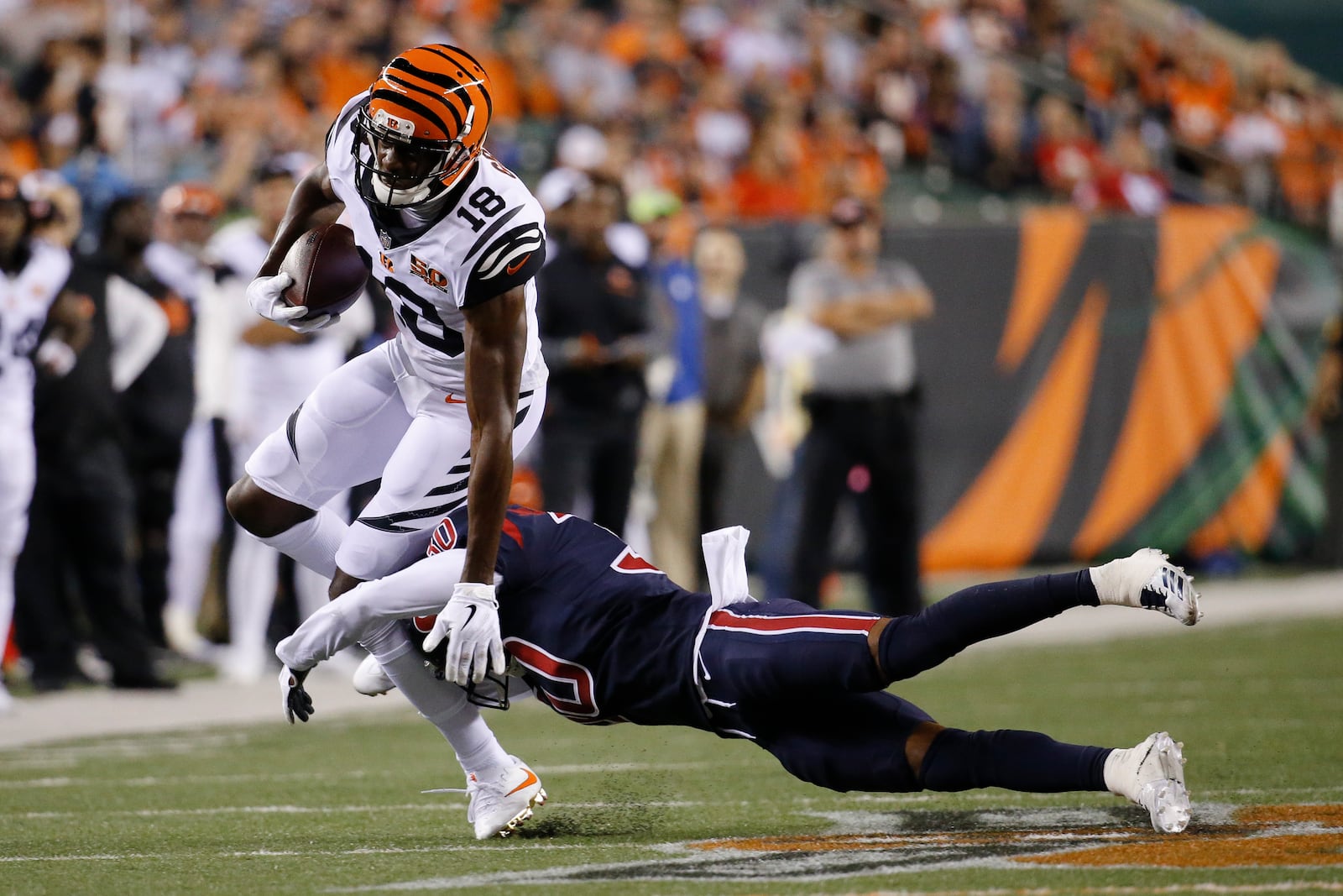 Cincinnati Bengals wide receiver A.J. Green (18) is tackled by Houston Texans cornerback Kevin Johnson (30) in the second half of an NFL football game, Thursday, Sept. 14, 2017, in Cincinnati. (AP Photo/Frank Victores)