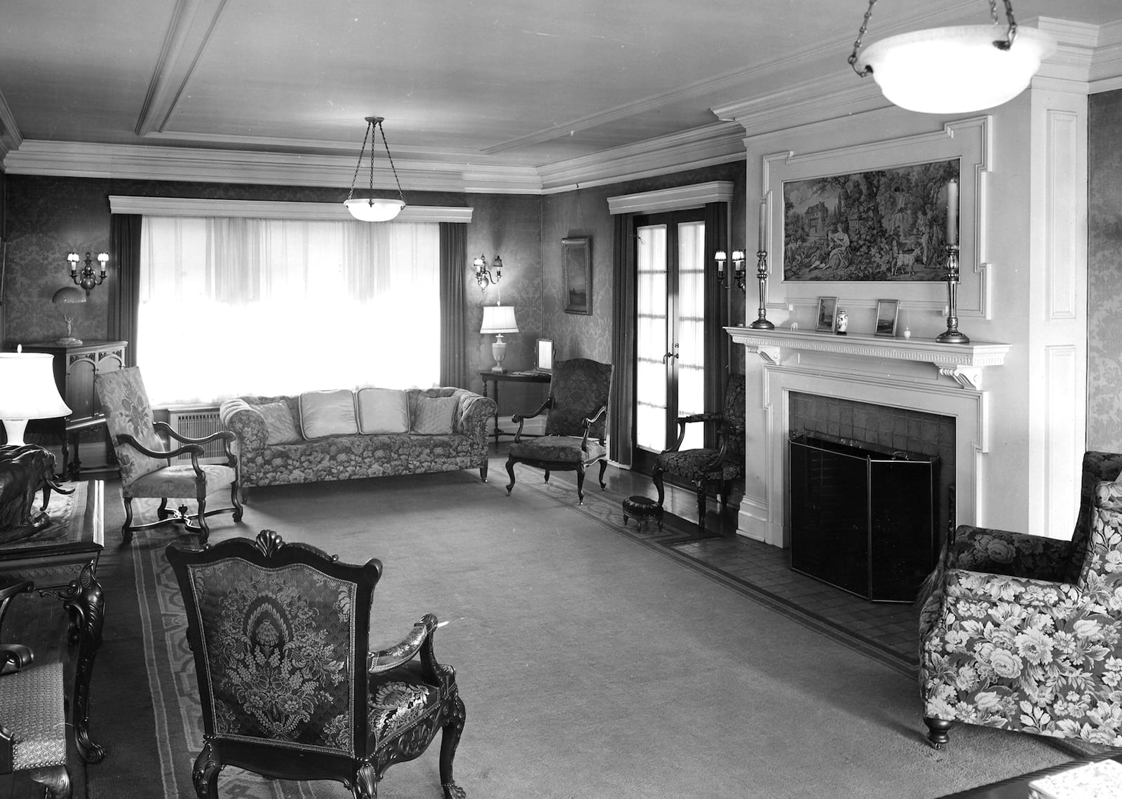 A 1948 view of the living room at Hawthorn Hill with the walls covered in gold damask. Recently the signature of the draper who installed the wall covering was discovered. NCR ARCHIVE